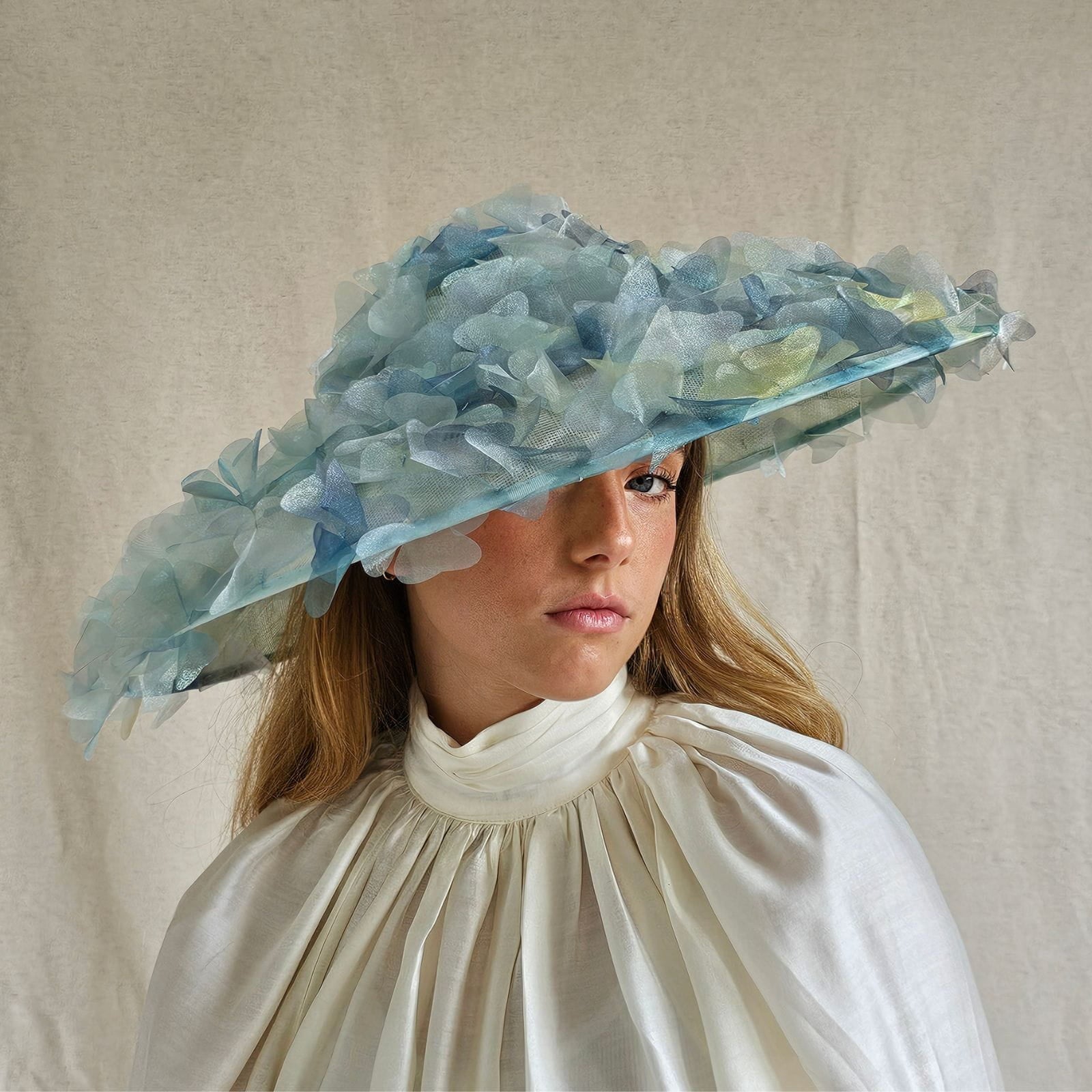 Ascot aqua and organza pictura hat with beautiful flowers, front view.
