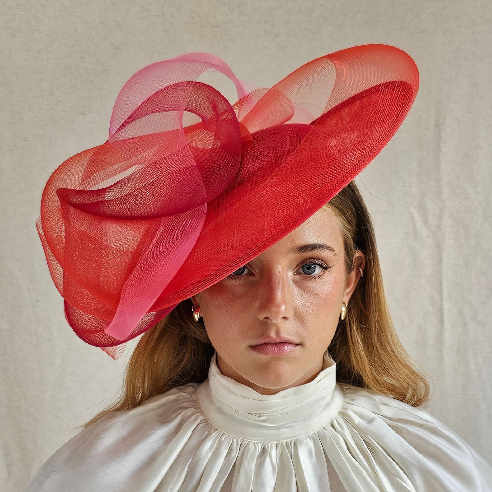 Red ascot disc hat with beautiful crin swirls, front view.