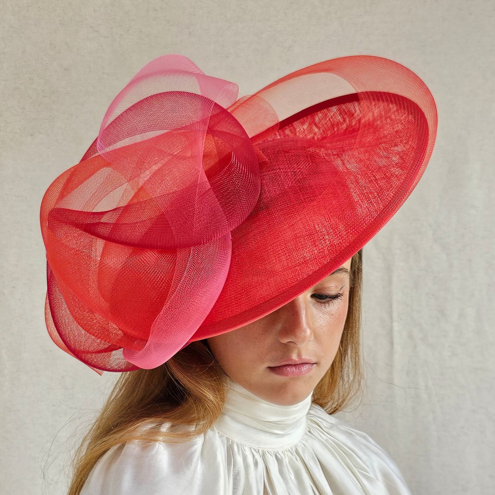 Red ascot disc hat with beautiful crin swirls, fronttilt view.