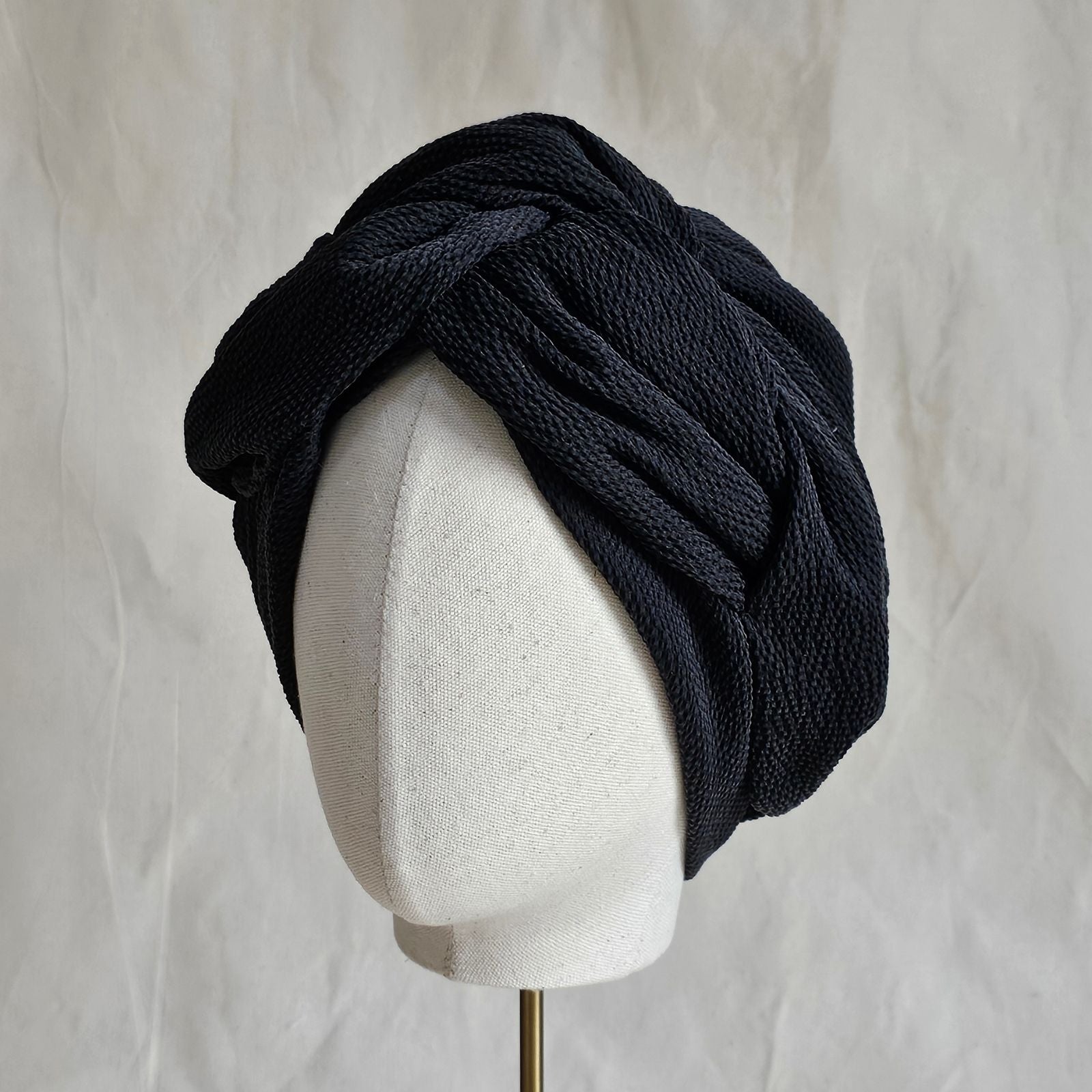 Black silk turban with beautifully woven twist, left view.