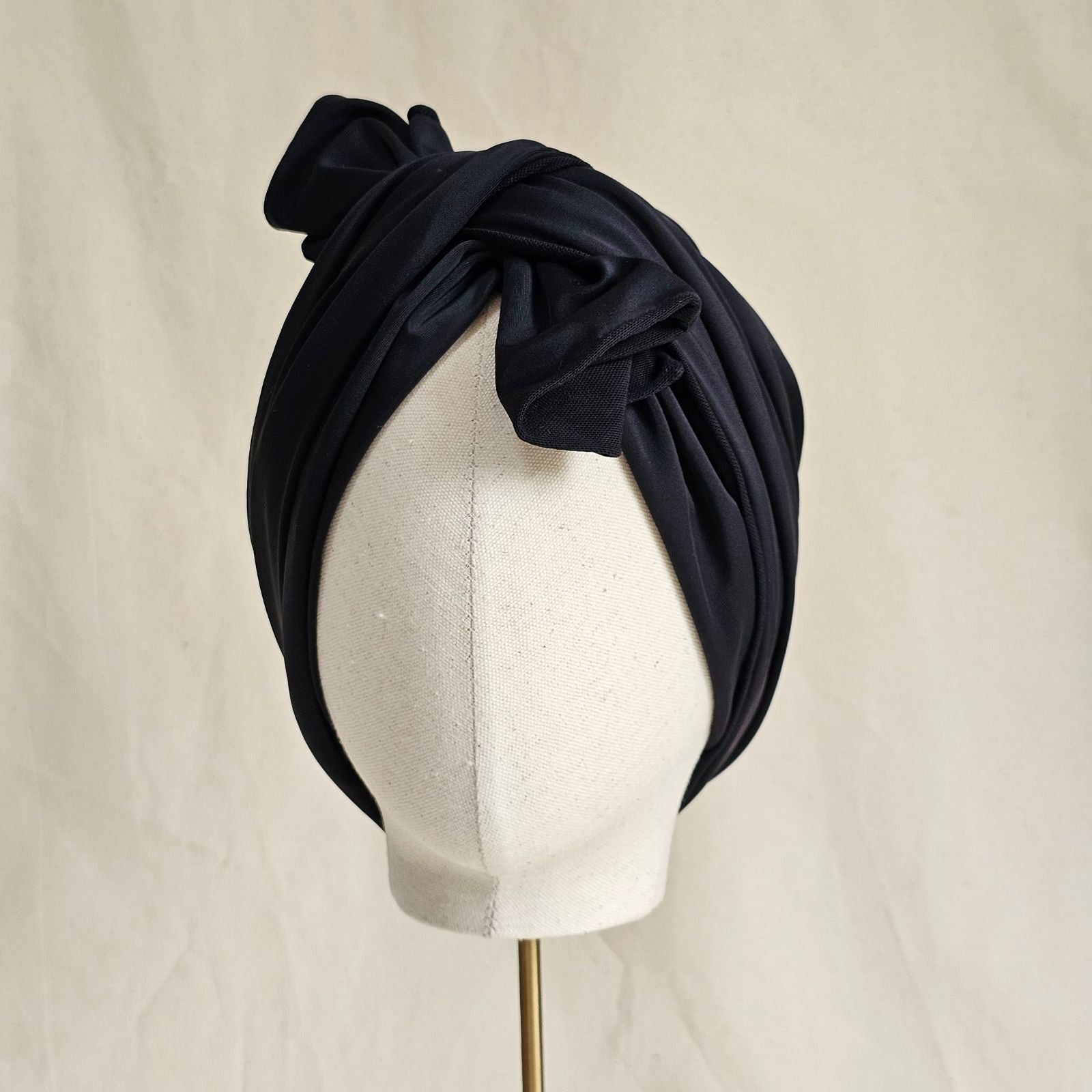 Black tie scarf beautiful swim turban, front view.