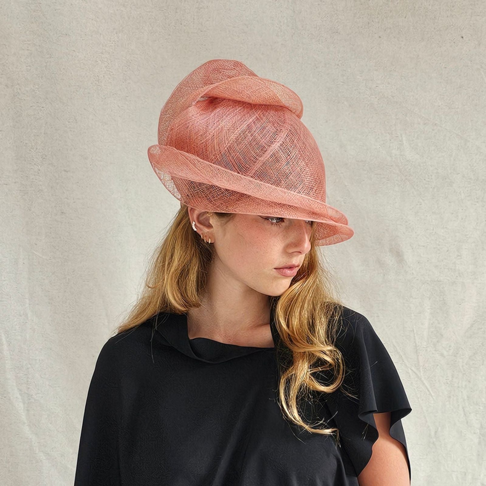 Coral sinamay cloche turban hat, side view.