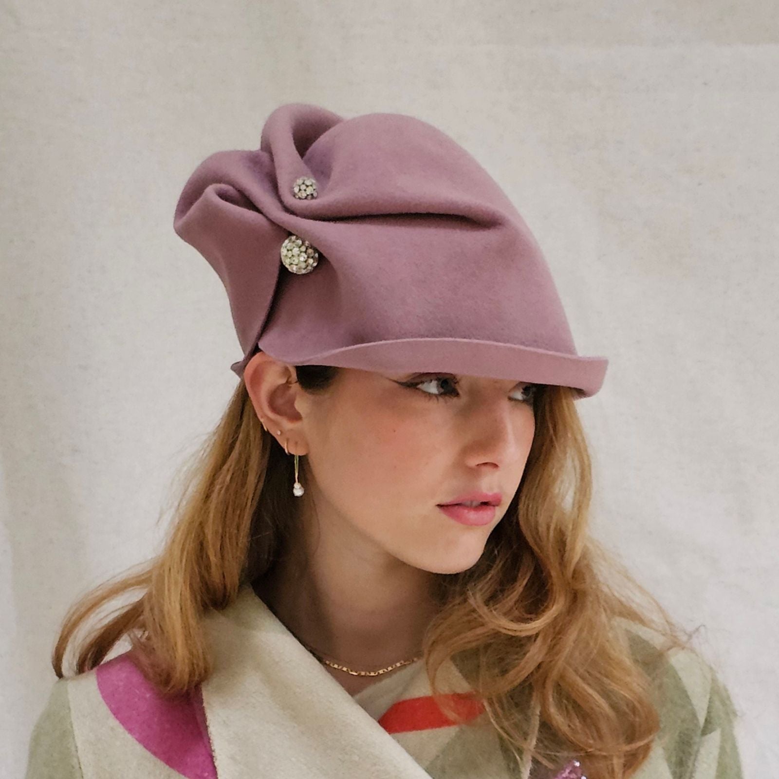 Dusky pink felt cloche hat with elegant scrunch framed by crystal diamanté globes.