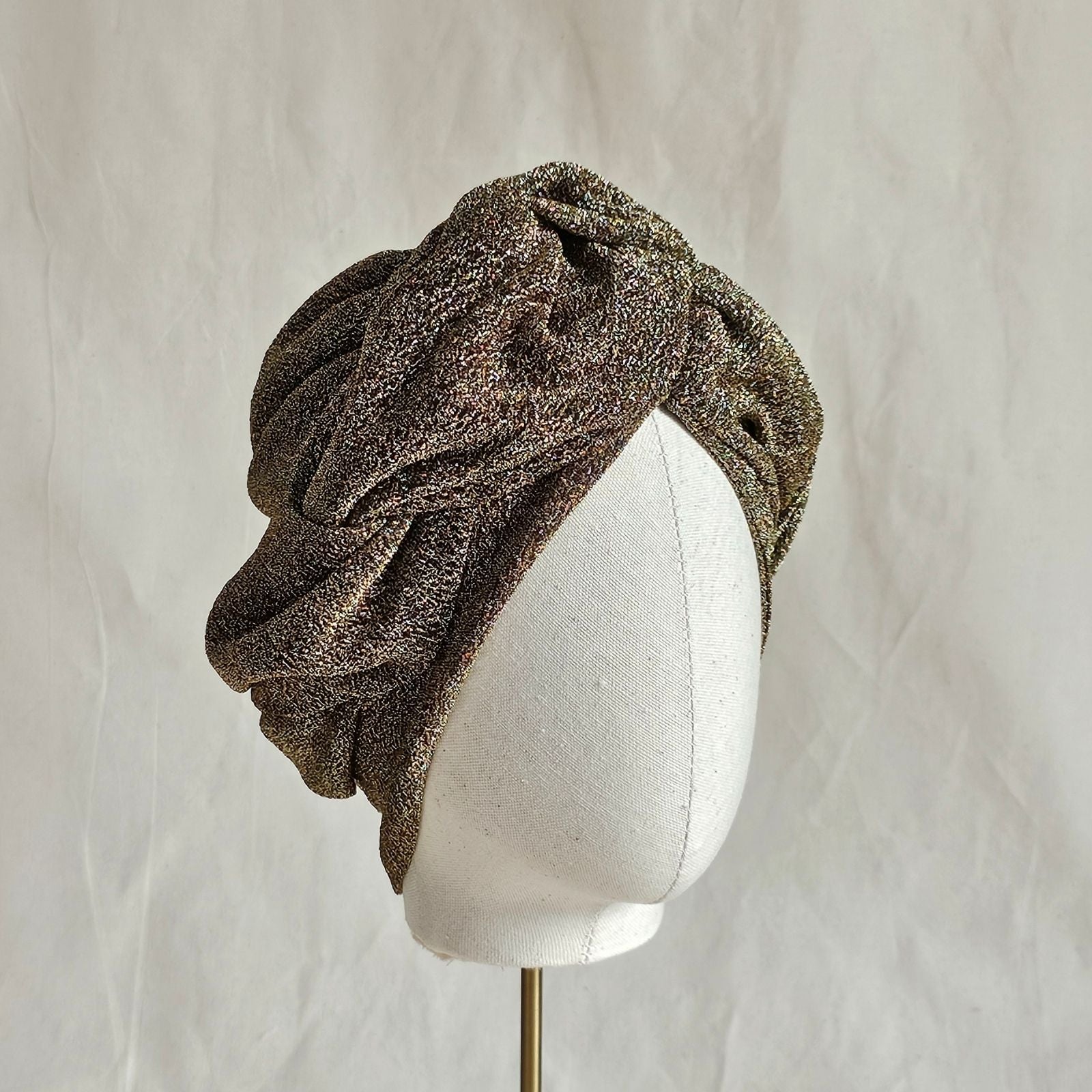 Gold lurex turban with beautiful twisted braid surround, right view.