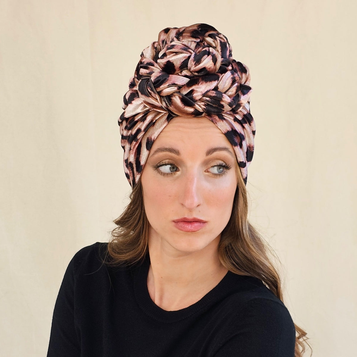 Leopard print velour braid rose turban, worn on a model.