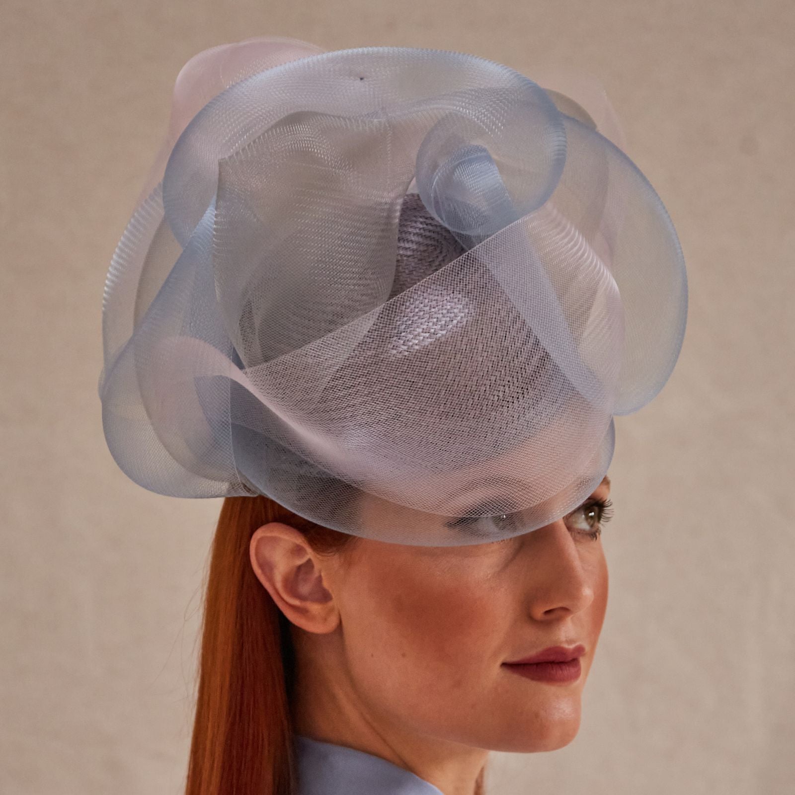 Lilac, blue and pink crin swirl pillbox hat, right view.