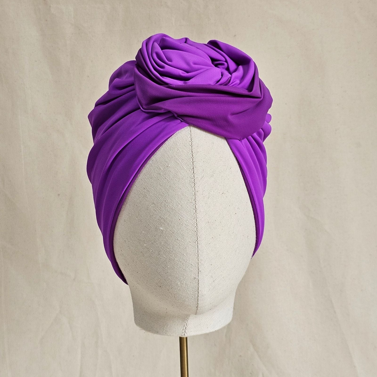 Lilac swim turban with beautiful sculpted rose knot, front view.