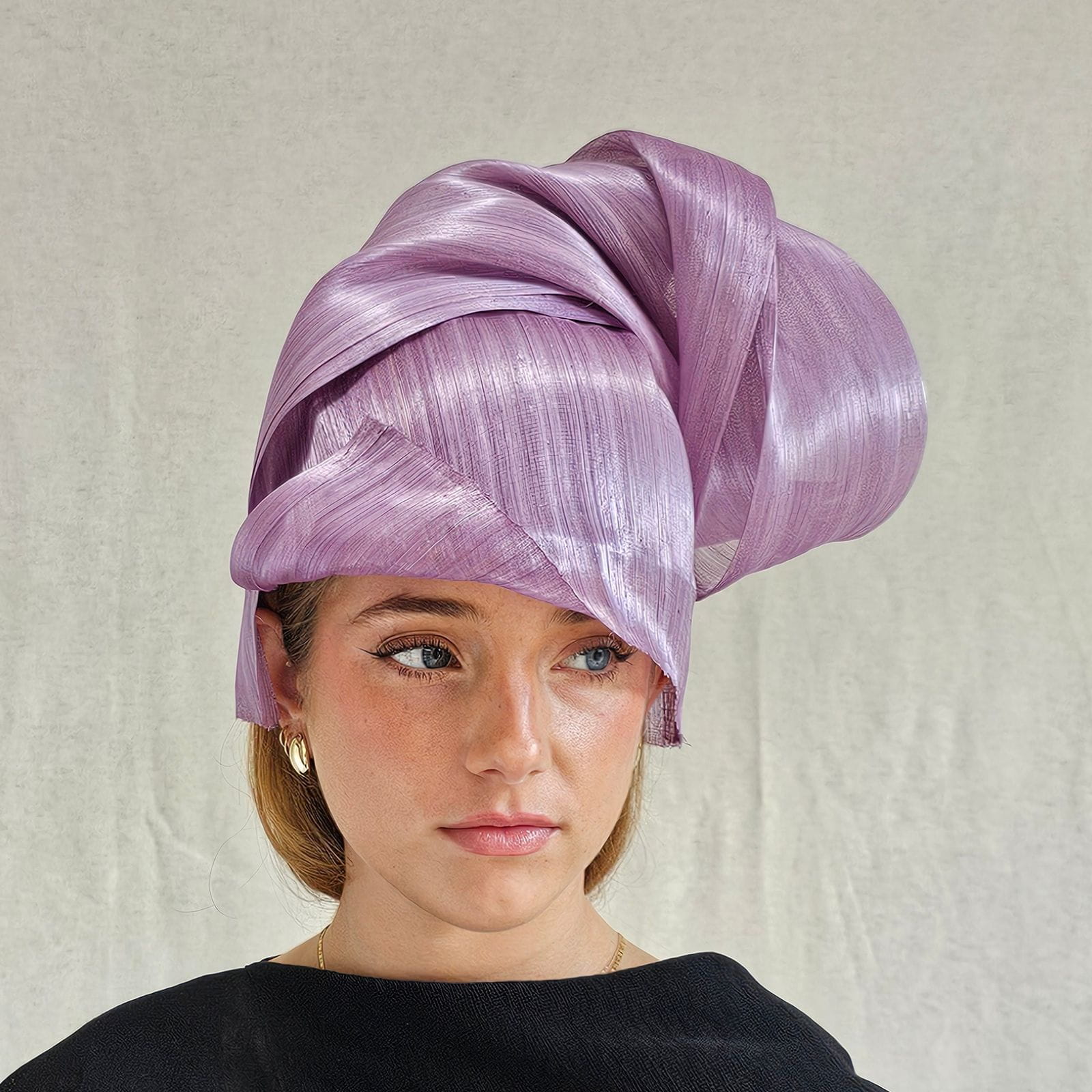 Lilac silk abaca chignon hat, front side view.
