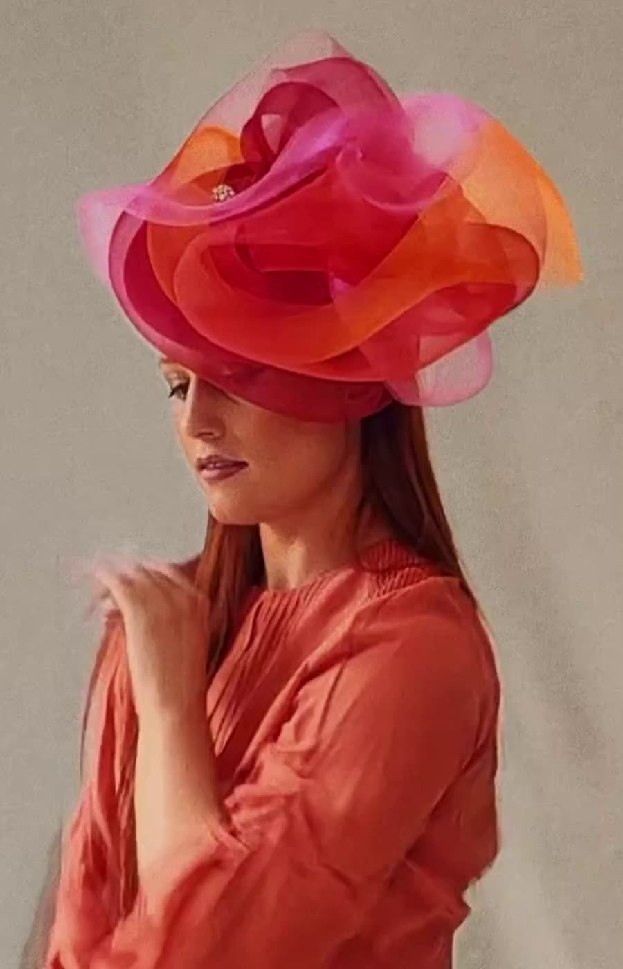 Nerida Fraiman model dancing wearing a luxury fascinator, London milliner
