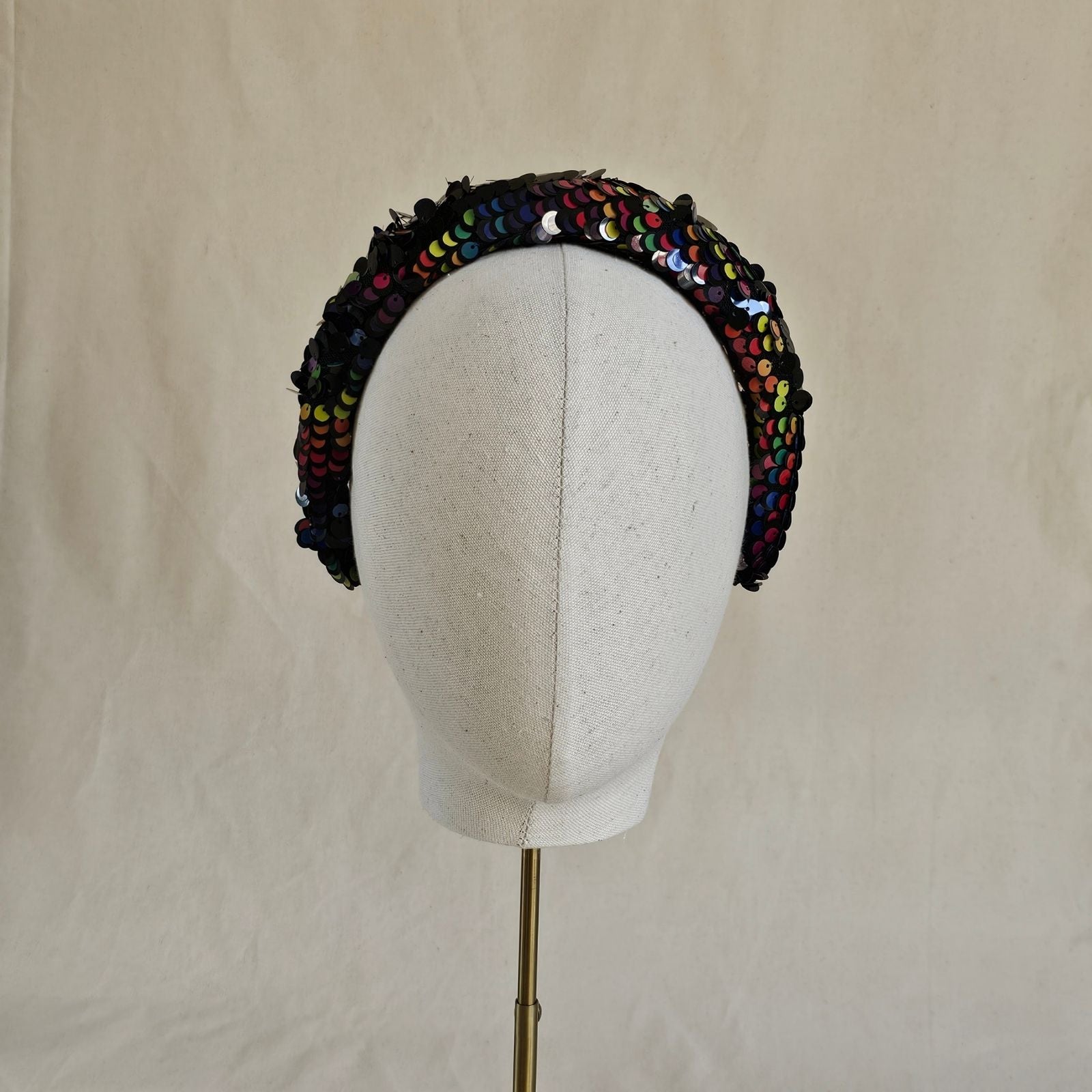 Multicolour sequin headband, front view.