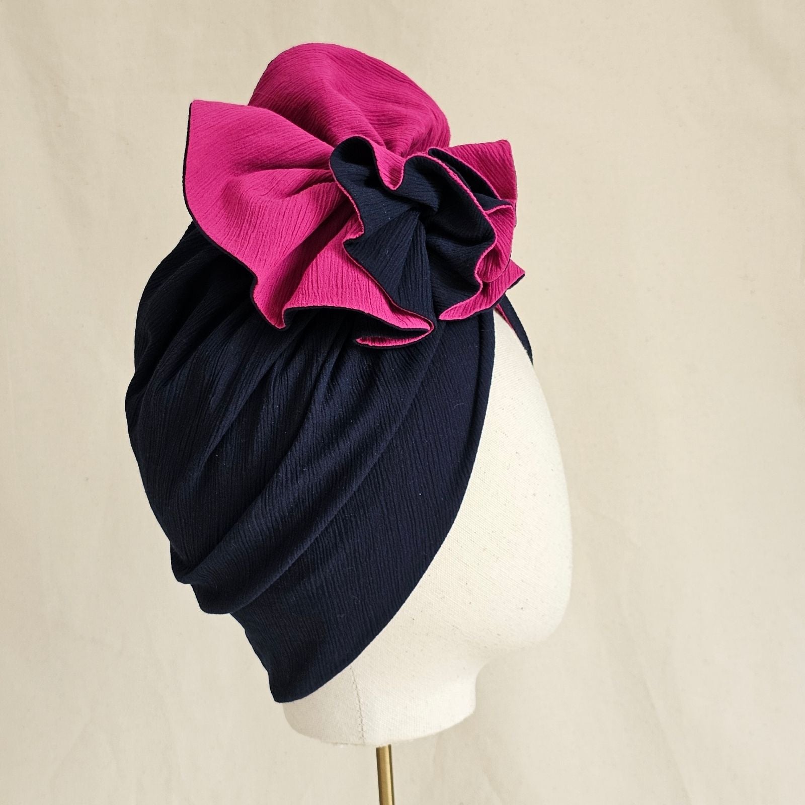 Navy and fuchsia cotton turban with exquisite ruffle, side view.