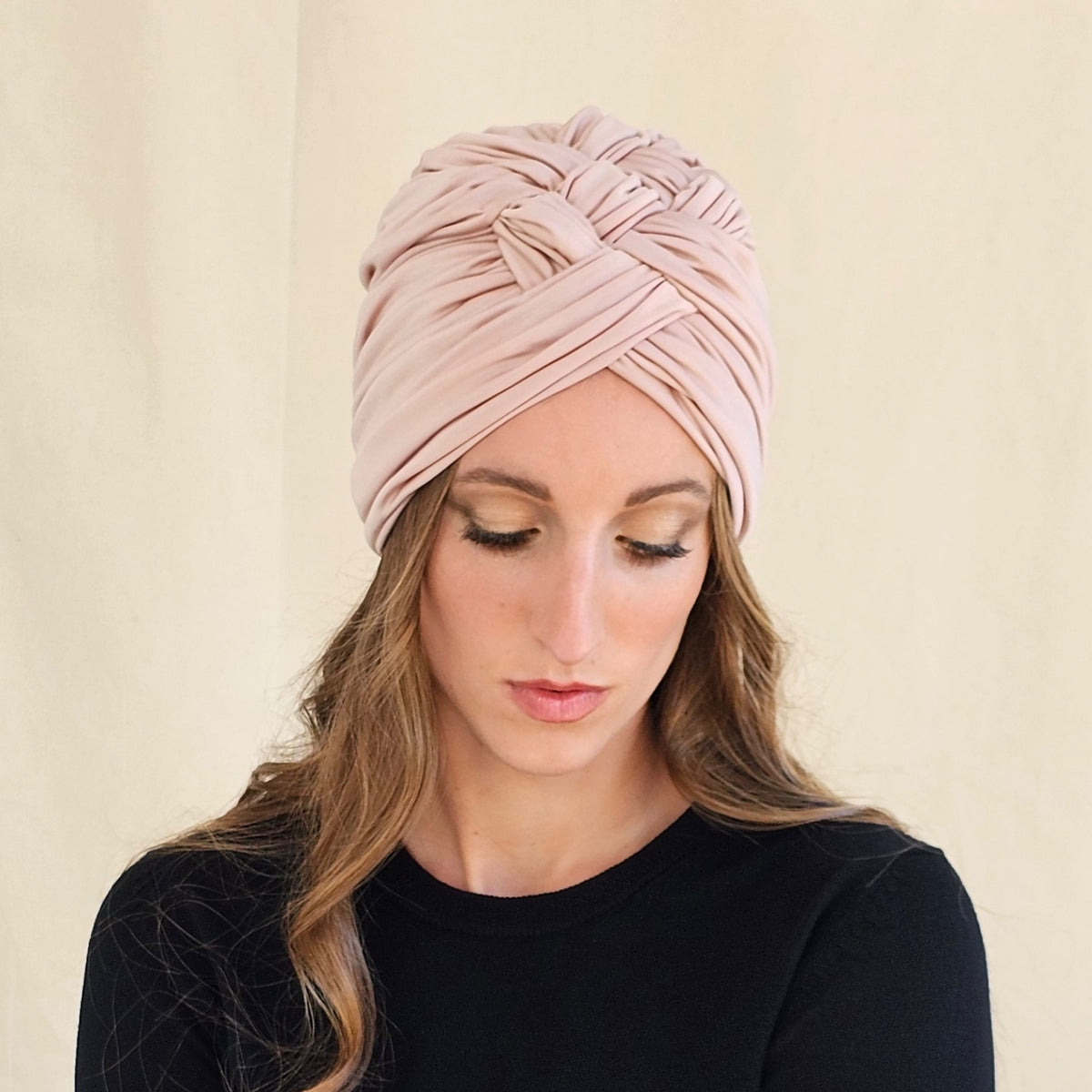 Front view of nude silk jersey turban showing crossed folds and
braiding.