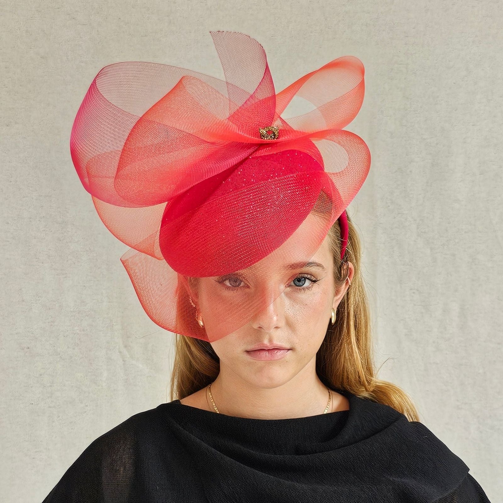 Red sparkle beret with beautiful crin swirl and gold pretzel knot embellishment, front view.
