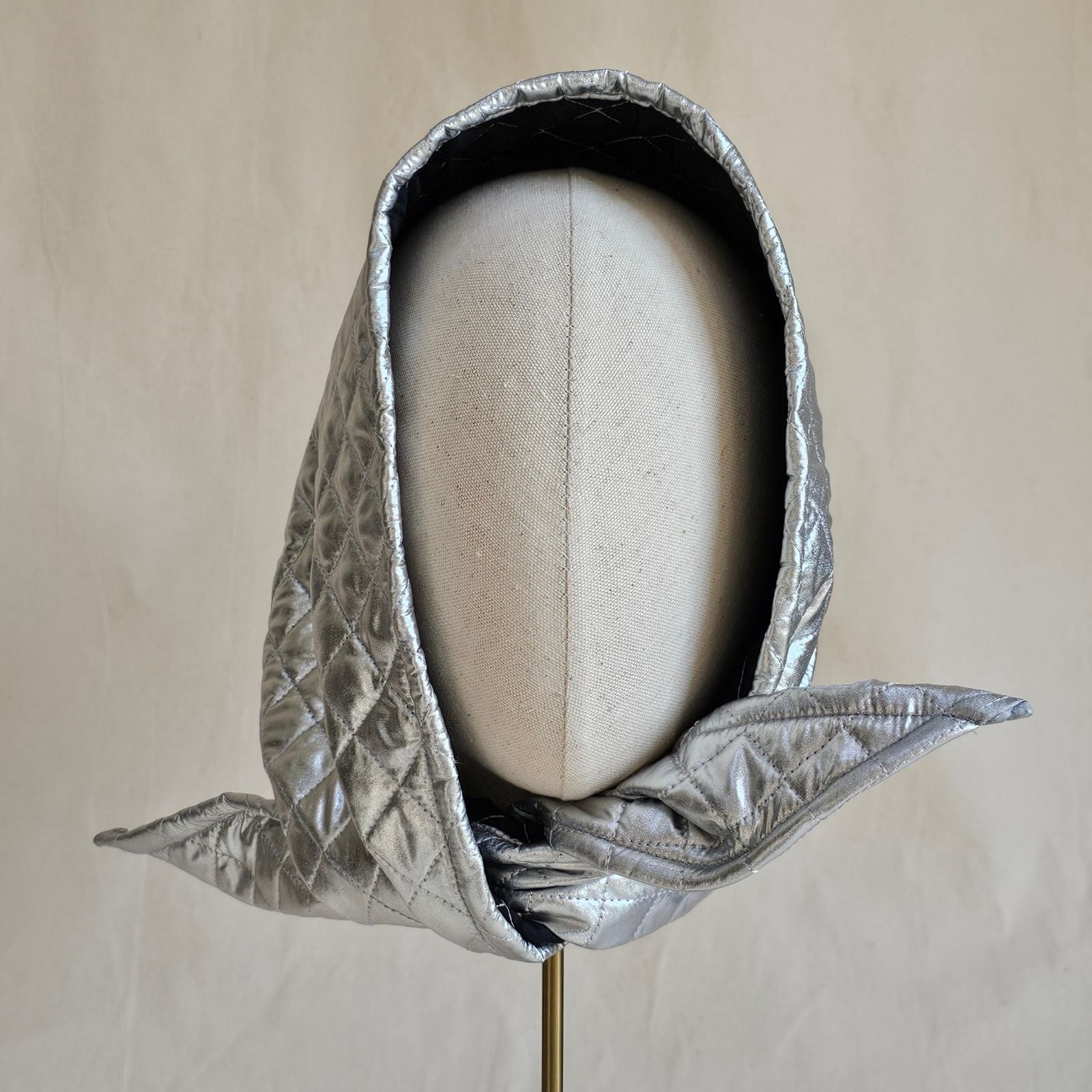 Silver quilted scarf hat, front view.