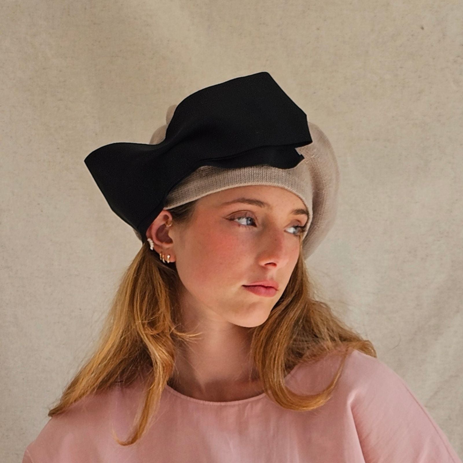 Taupe cotton beret with dramatic black bow, right view.