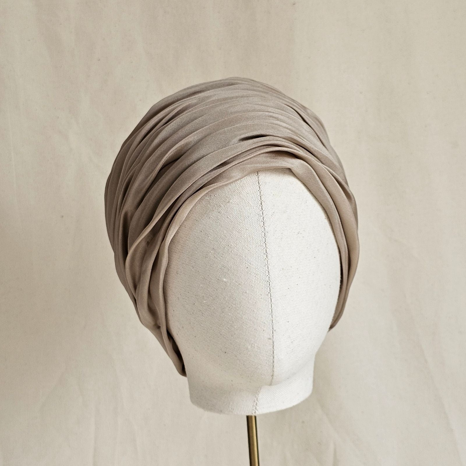 Taupe silk beautiful gathered turban, front view.