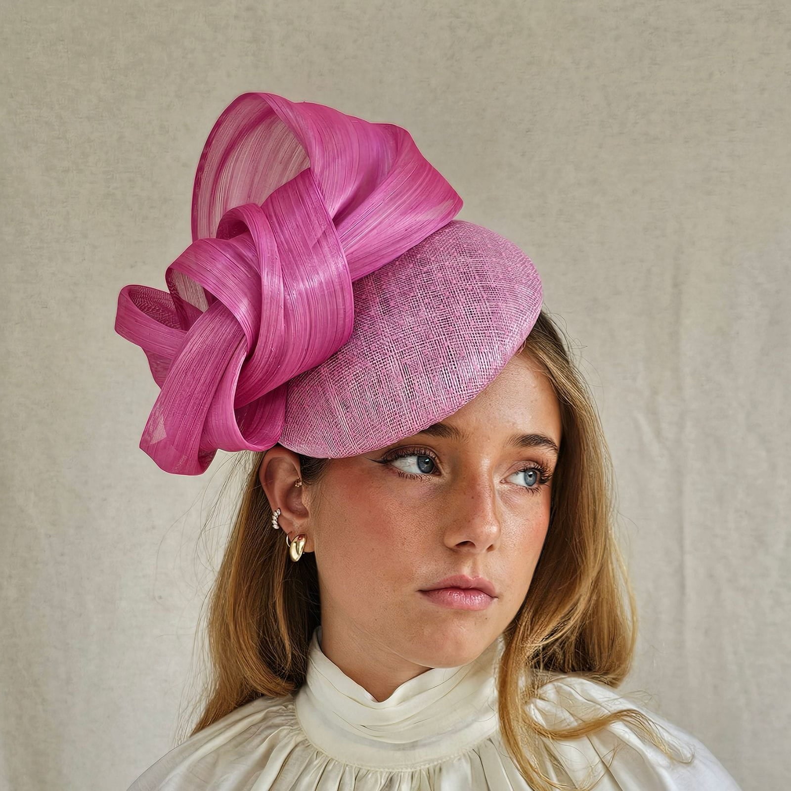 Pink wedding beret with silk abaca swirl bow embellishment, side view.
