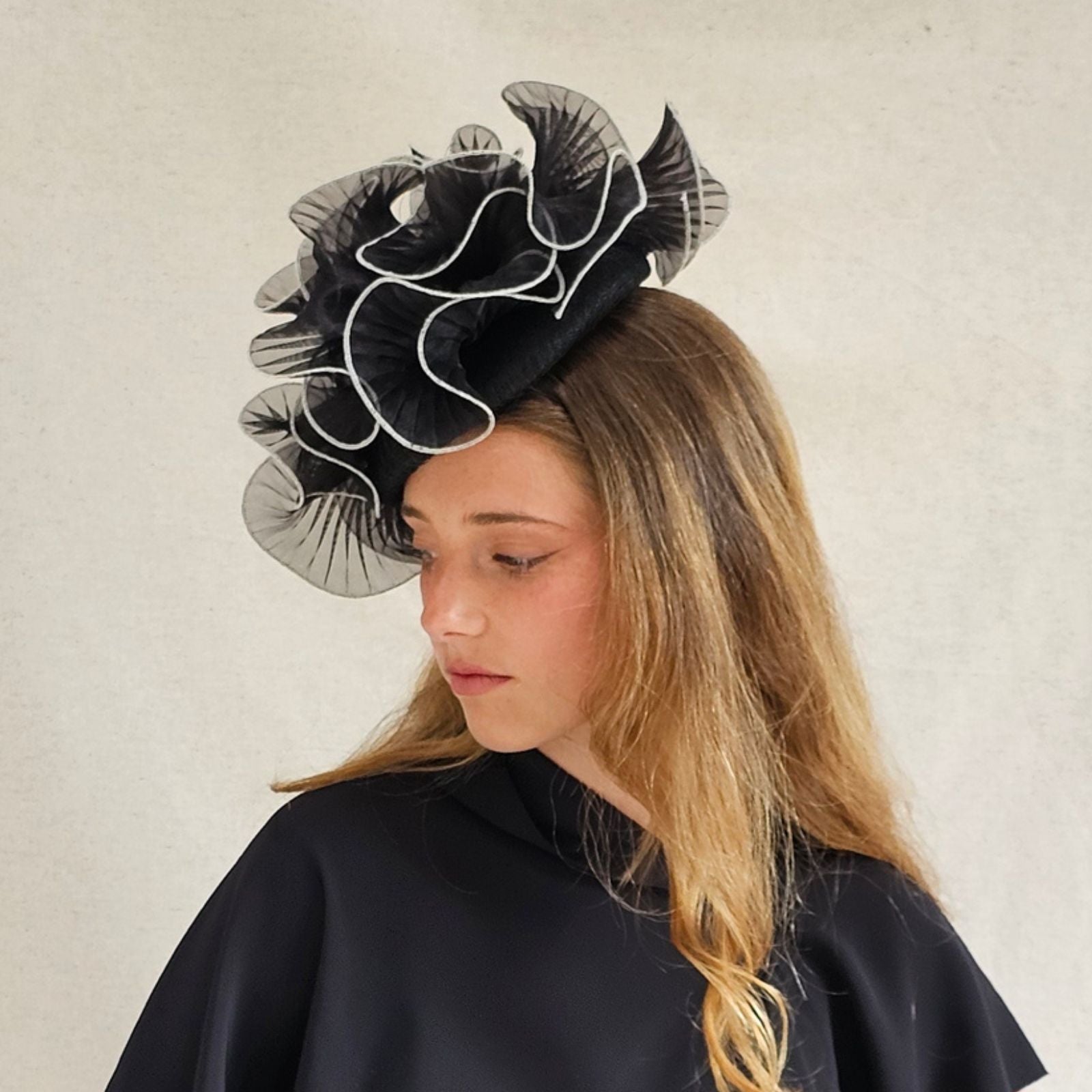Black ivory organza ruffle hat, left view.