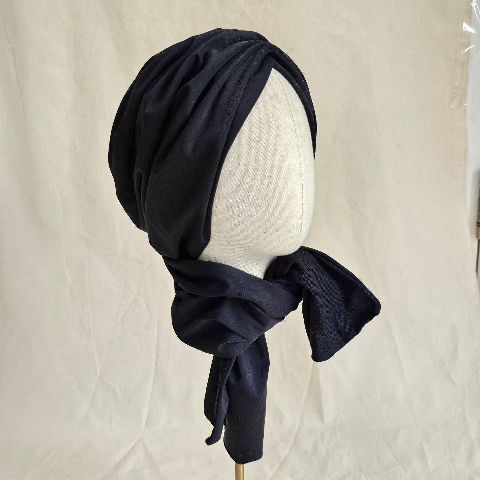 Black neck scarf swim turban, side view.