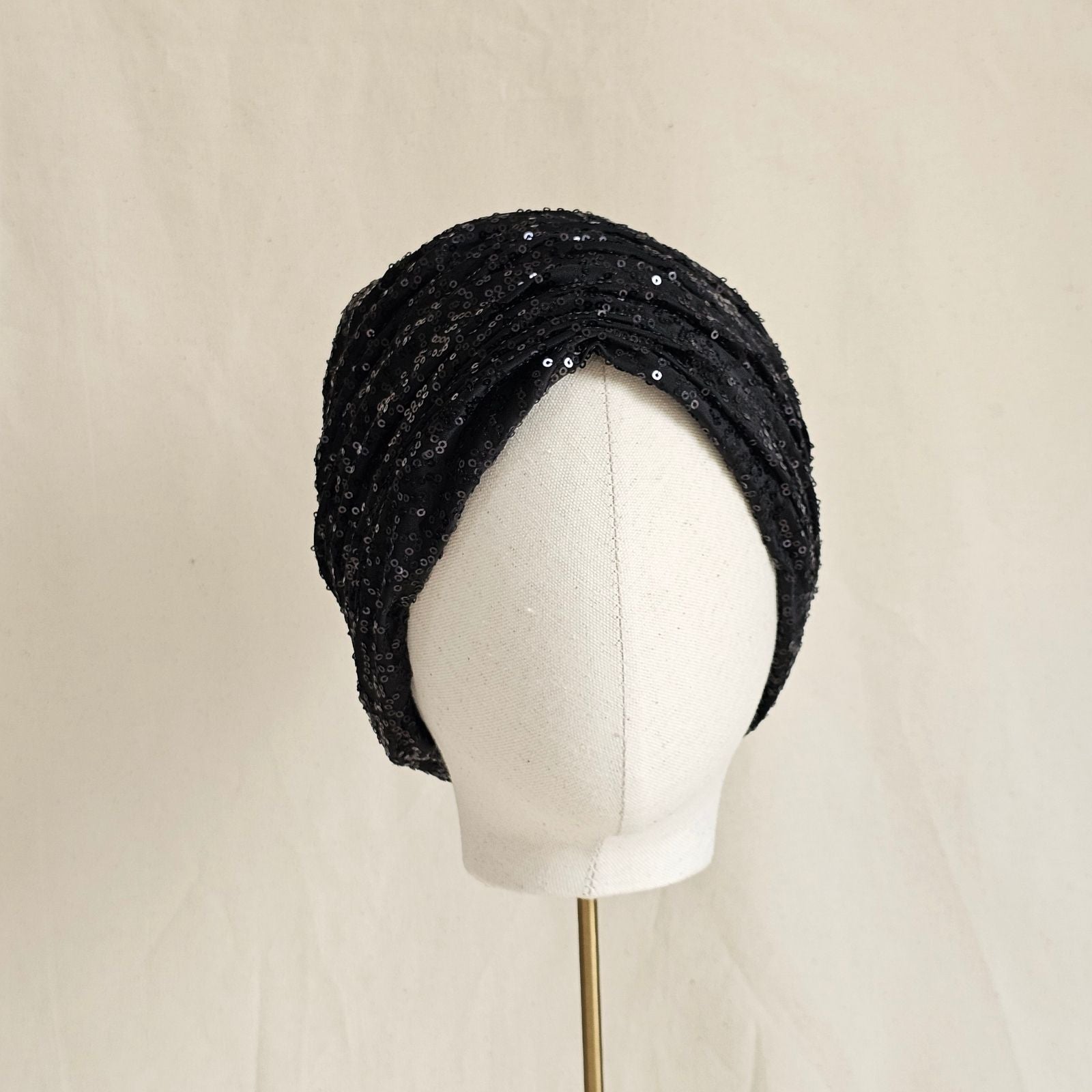 Black sequin turban with beautiful gathers, front view.