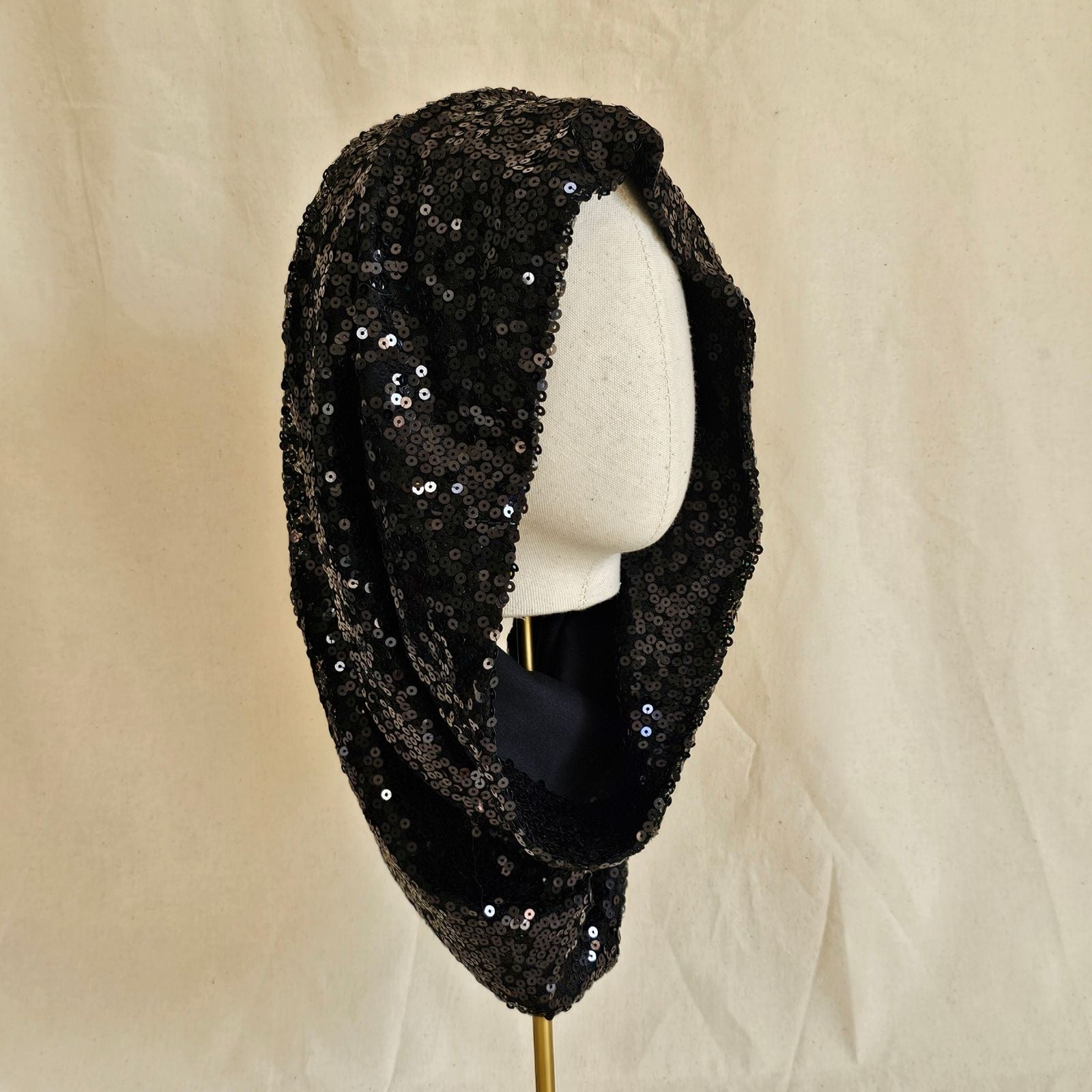 Black sequin elegant snood, angle view.