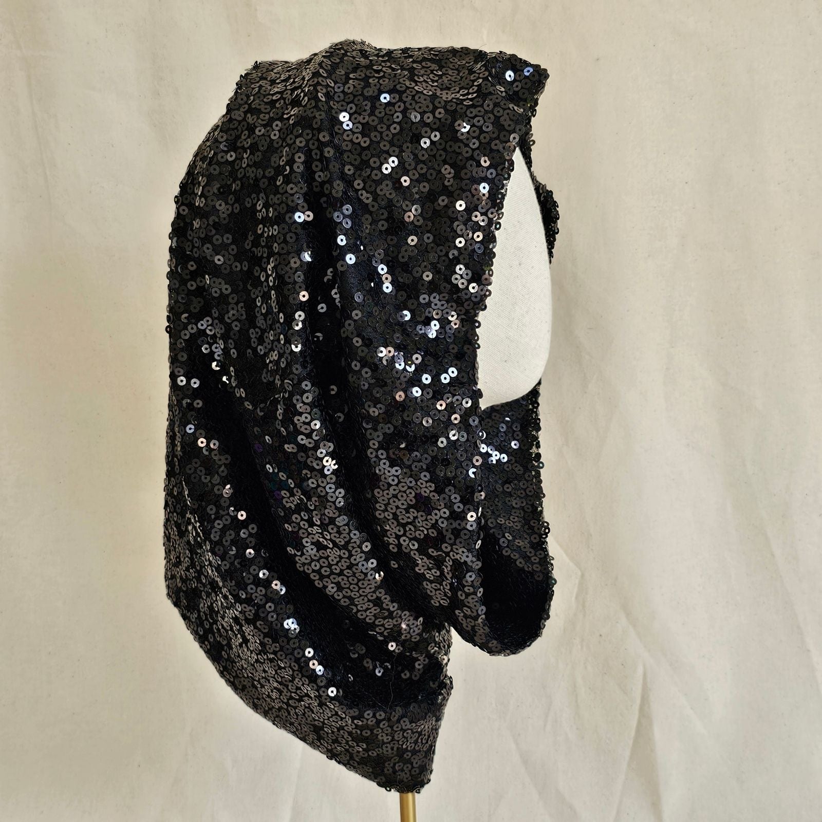 Black sequin elegant snood, side view.