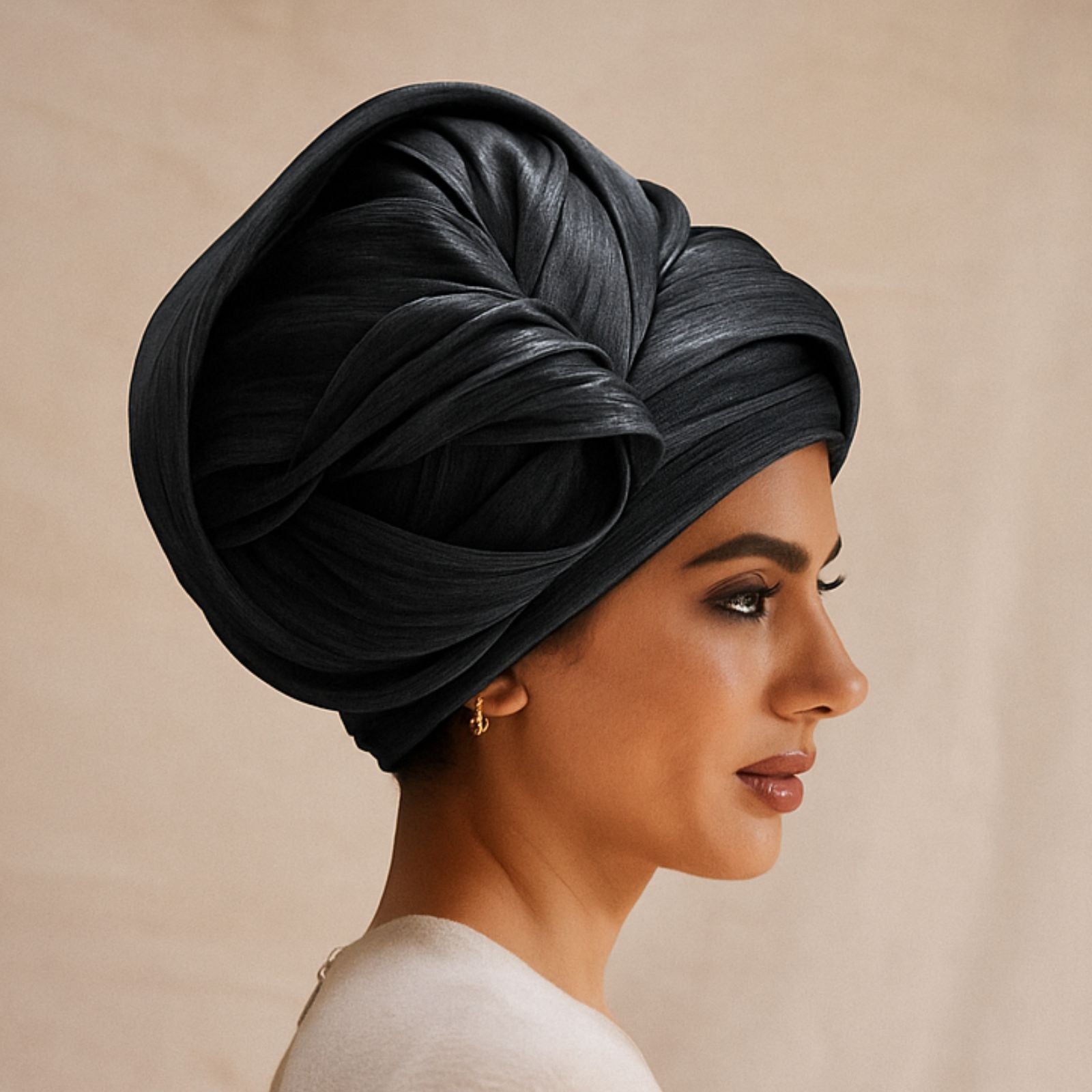 Model wearing black silk abaca turban hat.