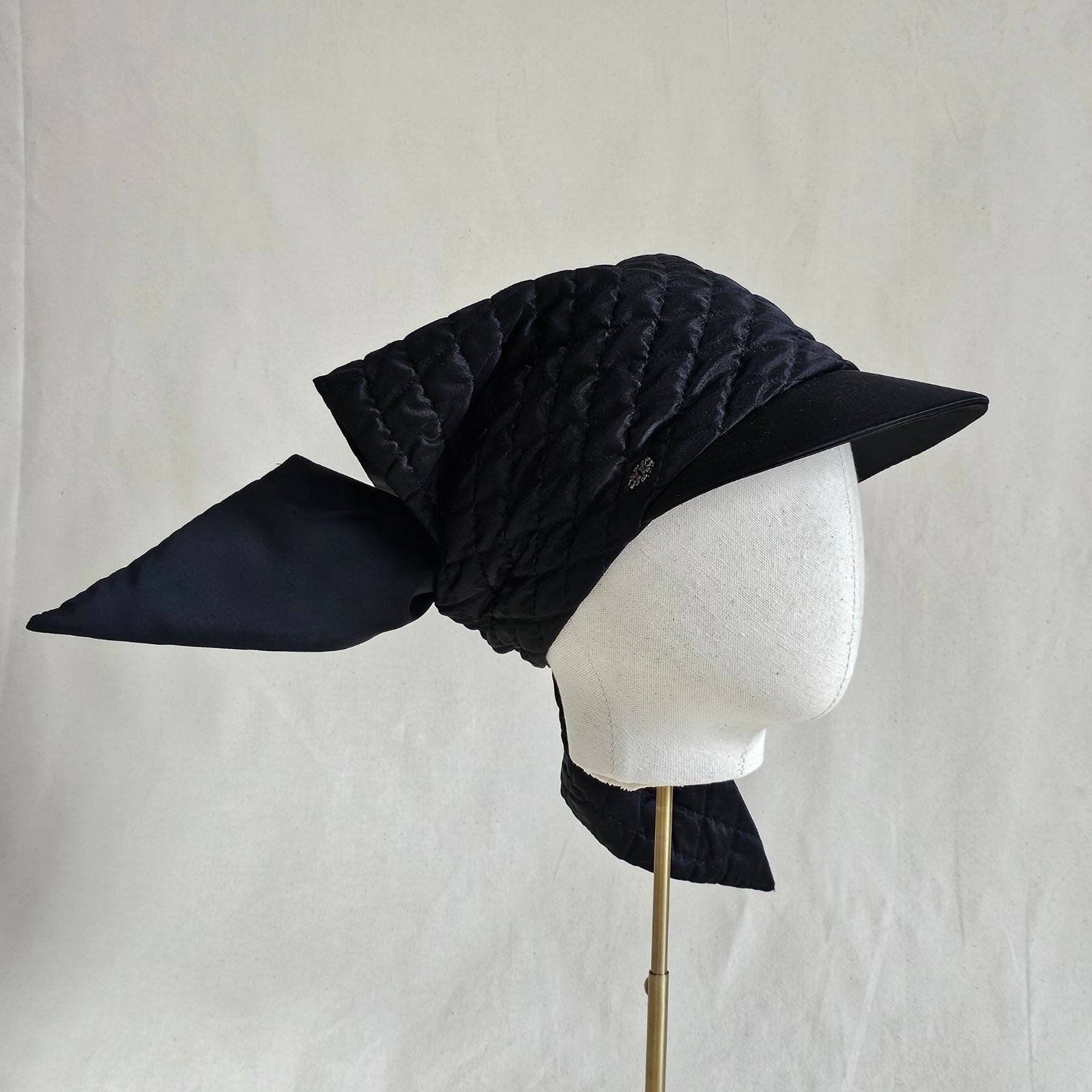 Black silk quilted peak scarf hat, right view.