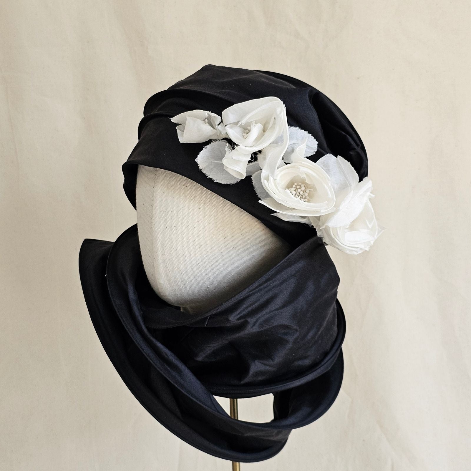 Black silk scarf turban with delicate ivory flowers, left wrapped view.