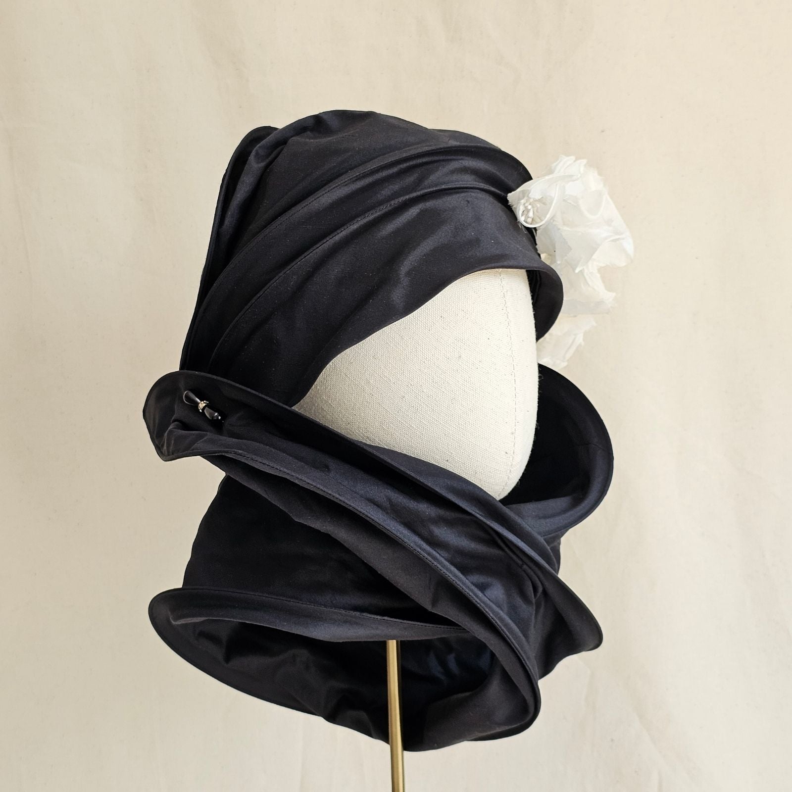 Black silk scarf turban with delicate ivory flowers, right side view.
