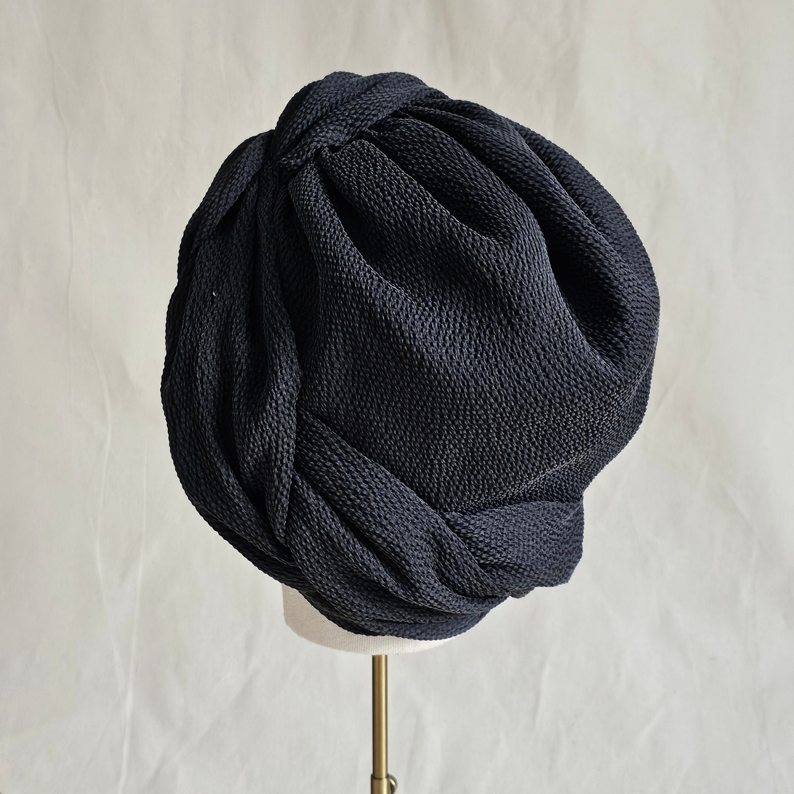 Black silk turban with beautifully woven twist, rear view.