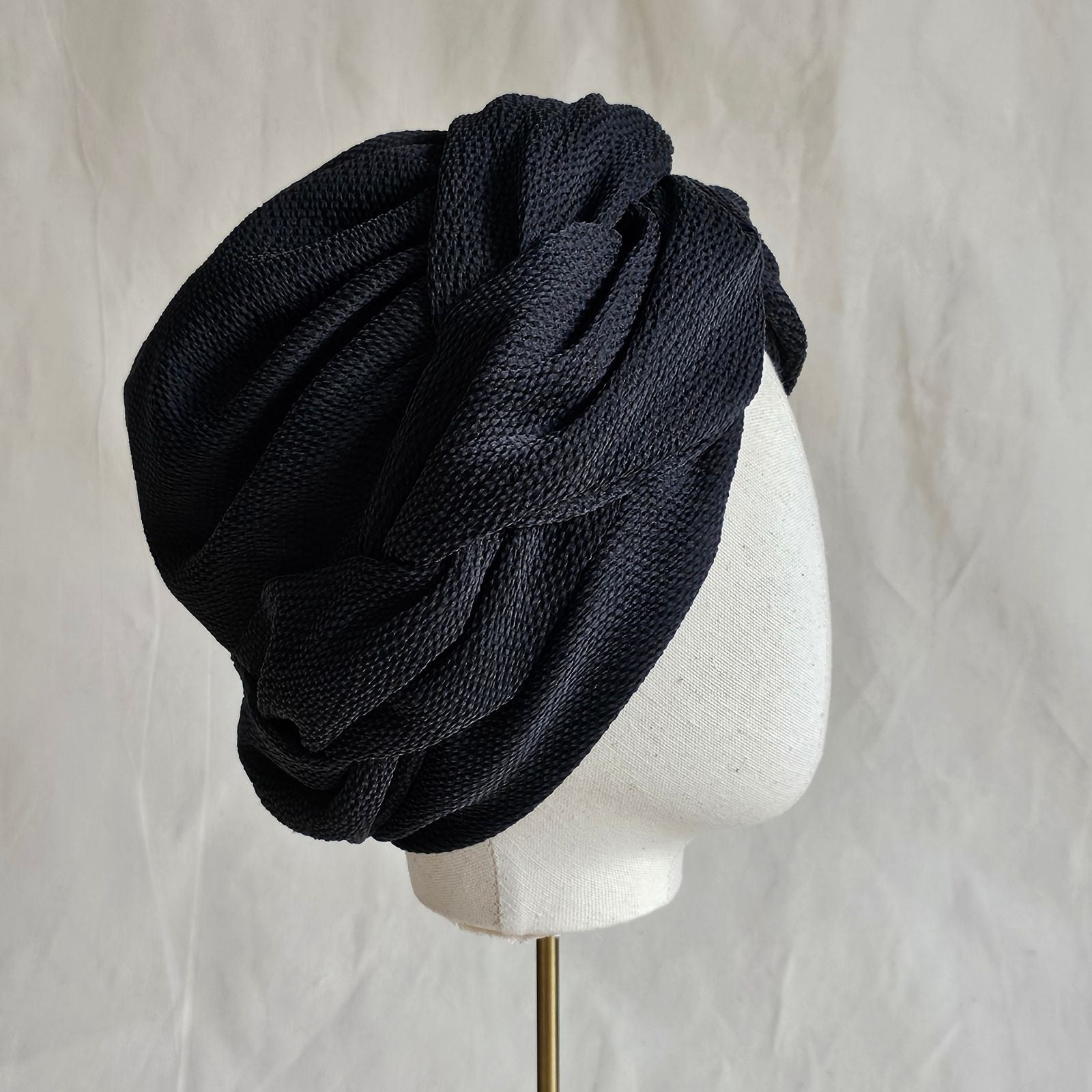 Black silk turban with beautifully woven twist, right view.