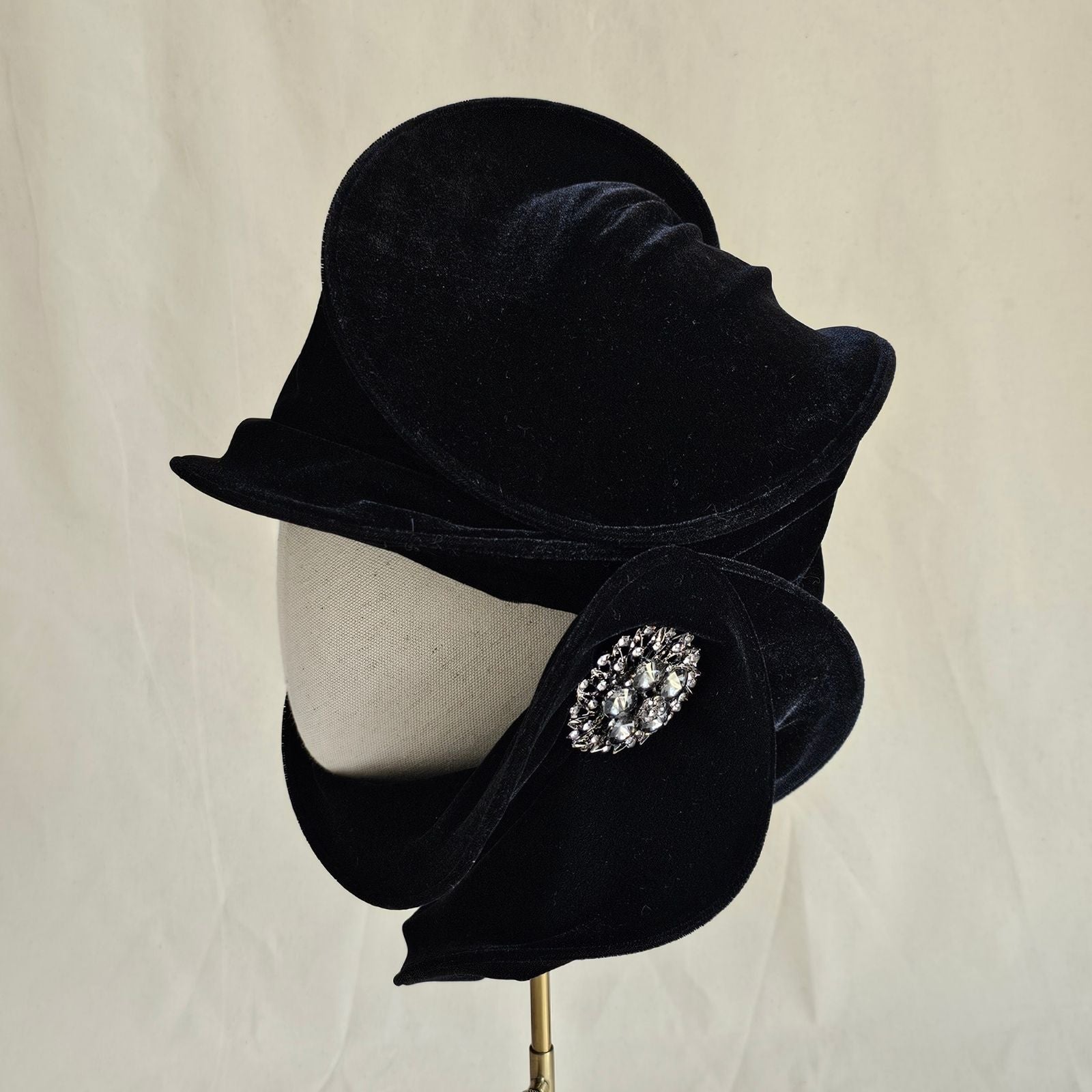 Black velvet scarf turban with beautiful brooch, left view.