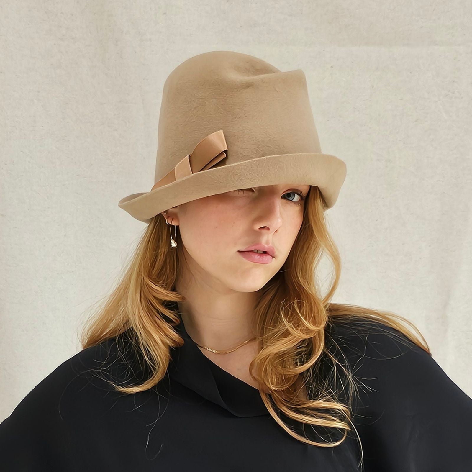 Camel felt trilby with beautiful bow, right view.