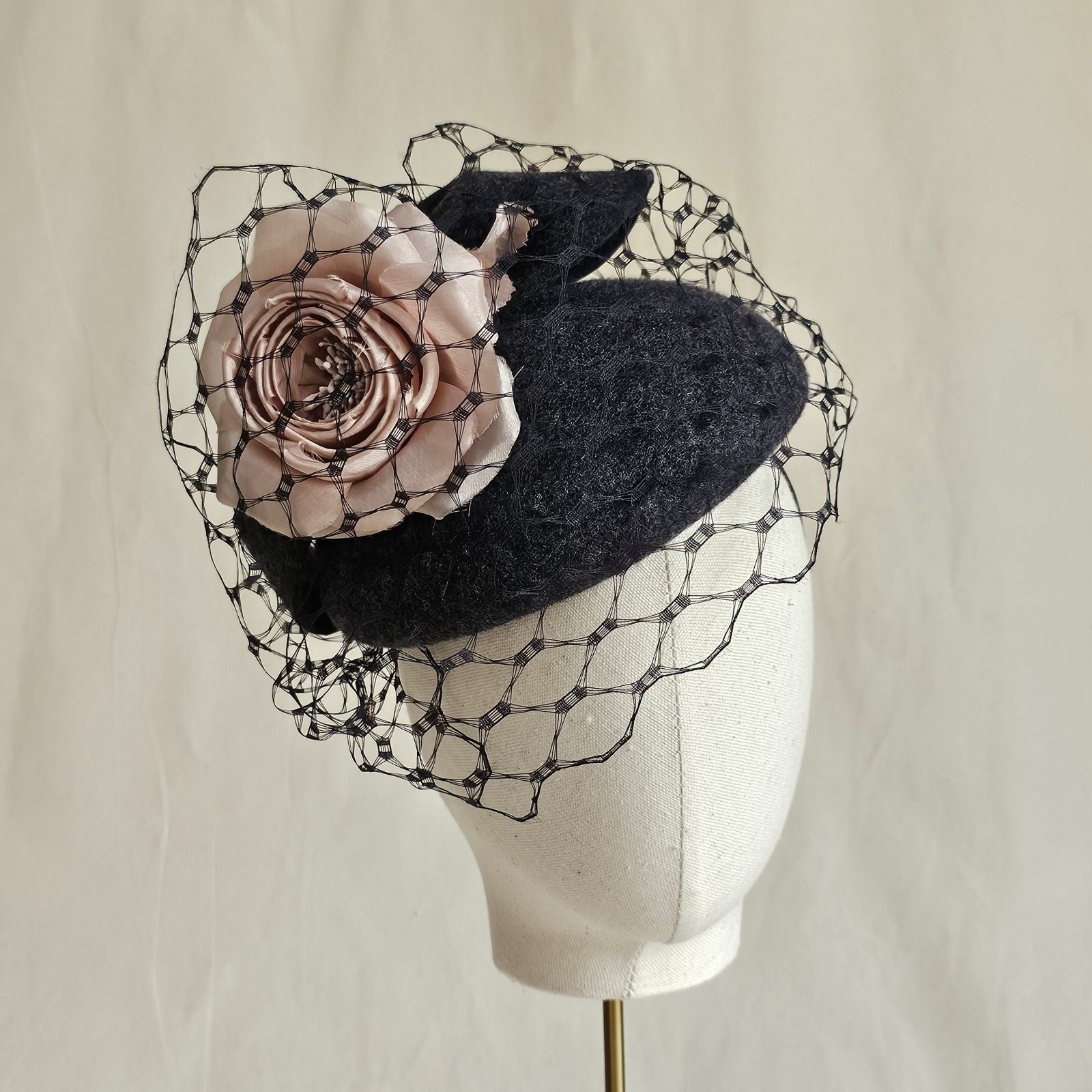 Charcoal felt beret with beautiful pink rose and veiling, front view.