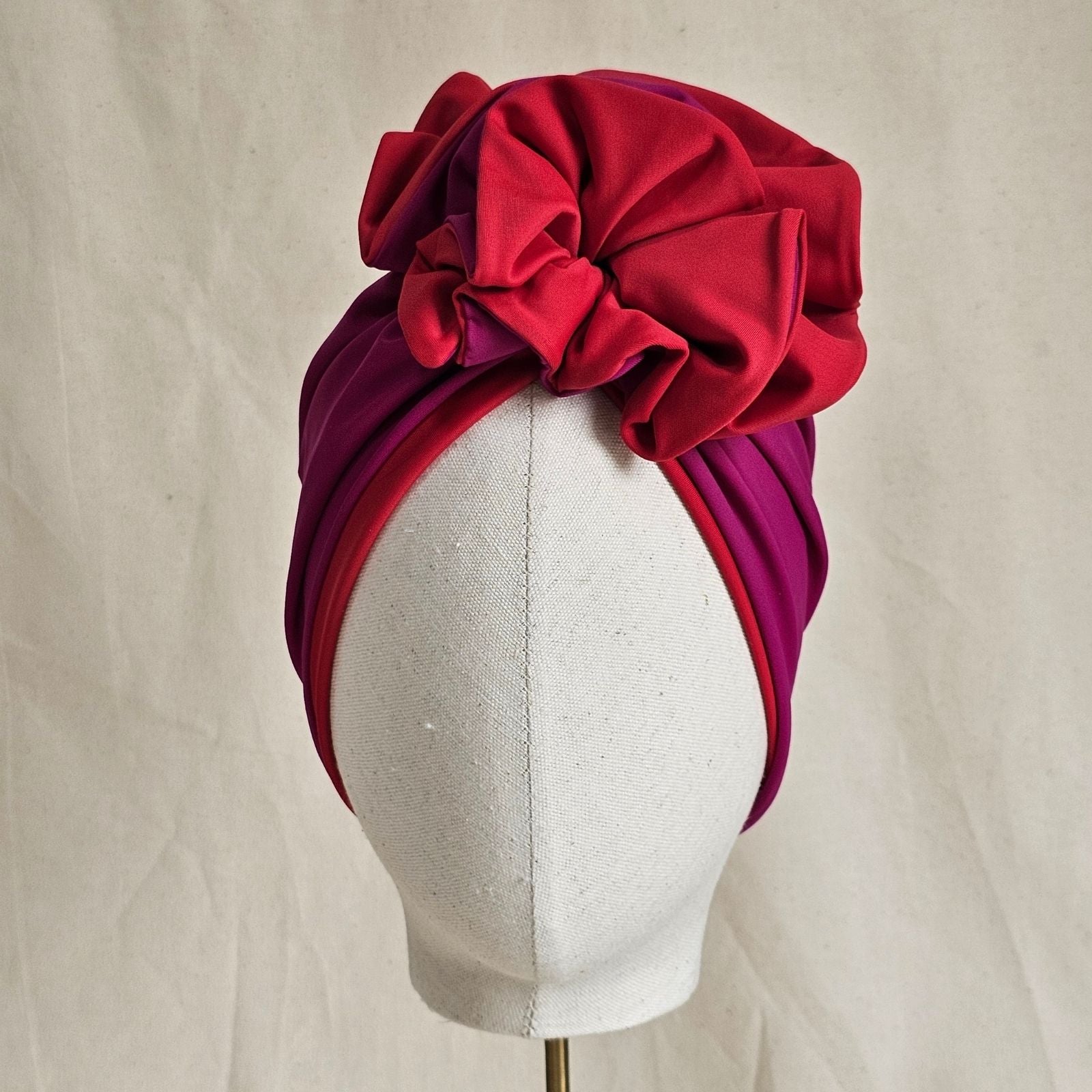 Fuchsia and red swim turban with dramatic ruffle, front view.