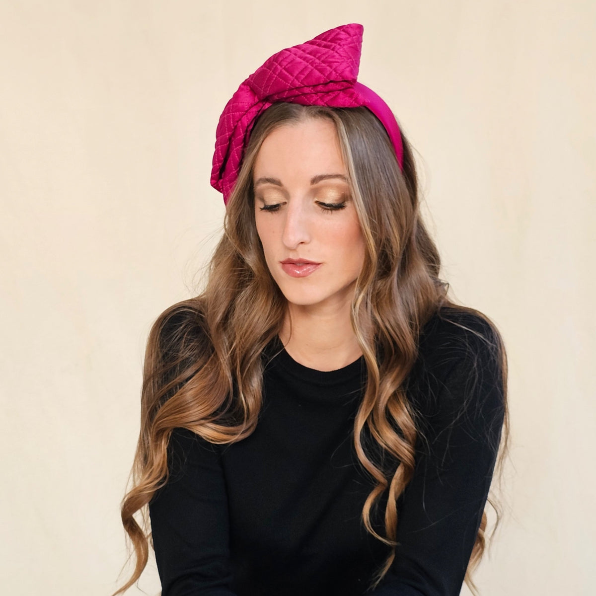 Fuchsia silk headband showing the upright quilted bow from an
angle.