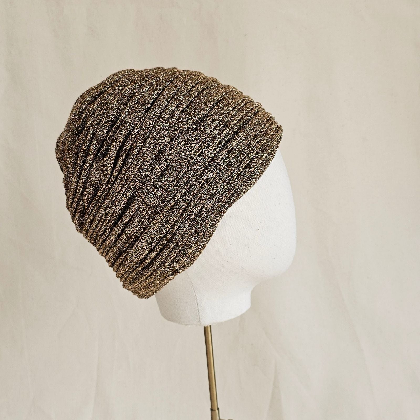 Gold lurex beautiful gathered turban, side view.