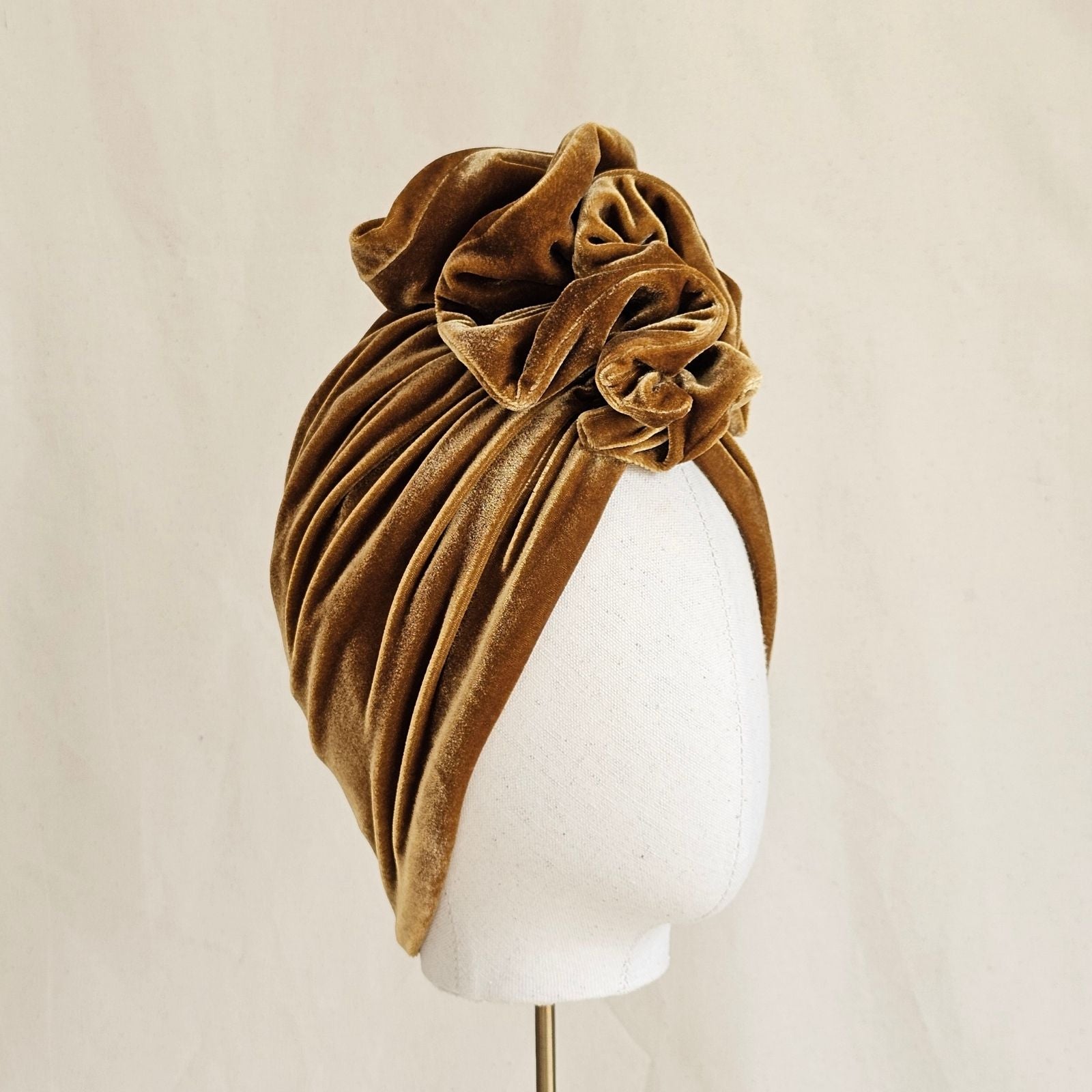 Gold velvet softly gathered turban with elegant ruffle, right view.