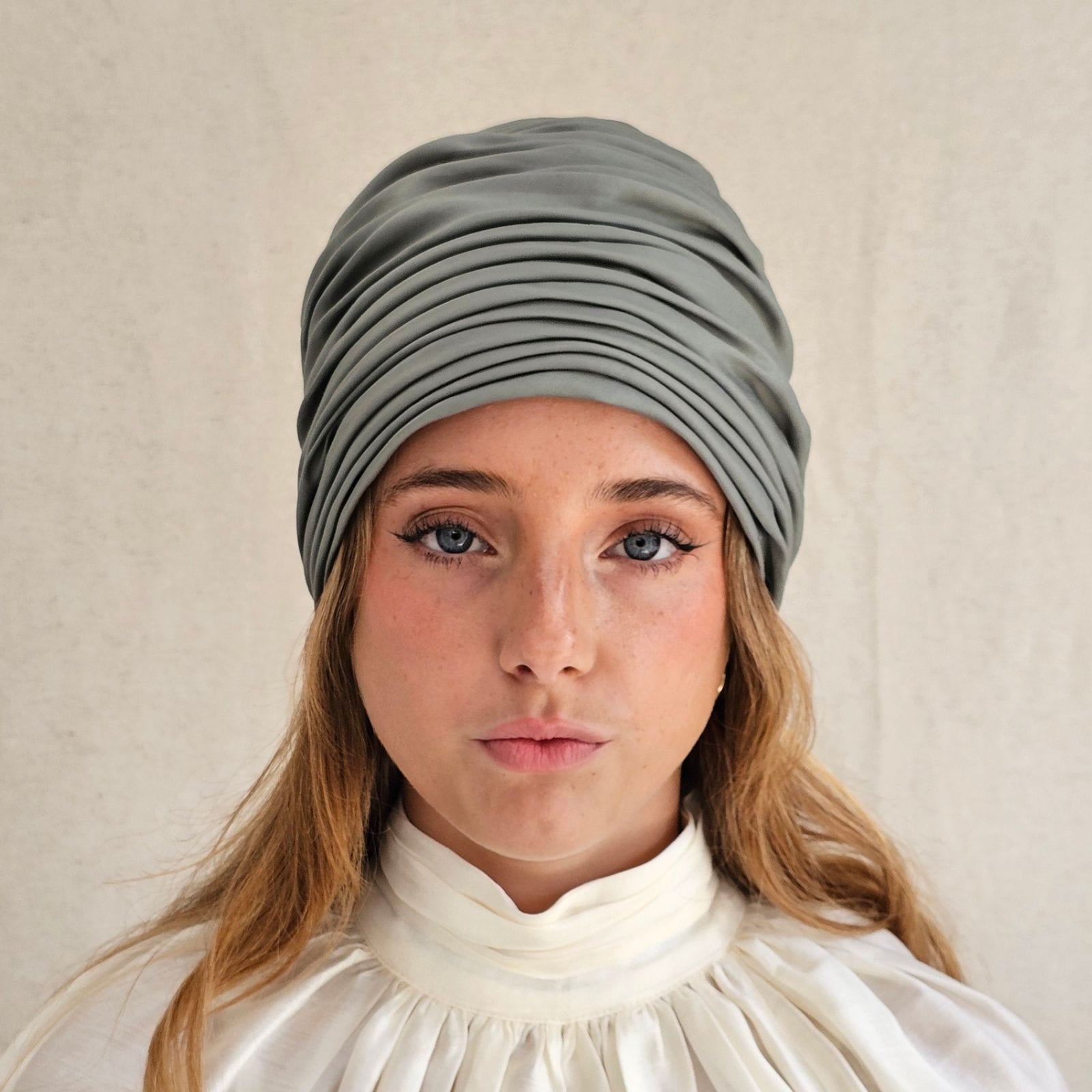 Green cotton gathered turban, front view.