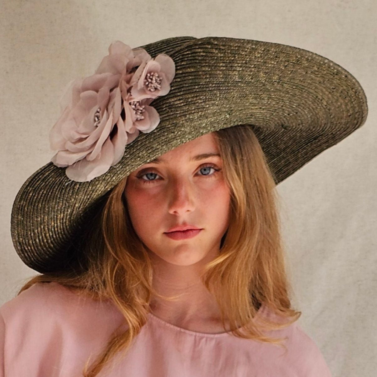 Green straw breton sunhat with beautiful pink flowers, front view.