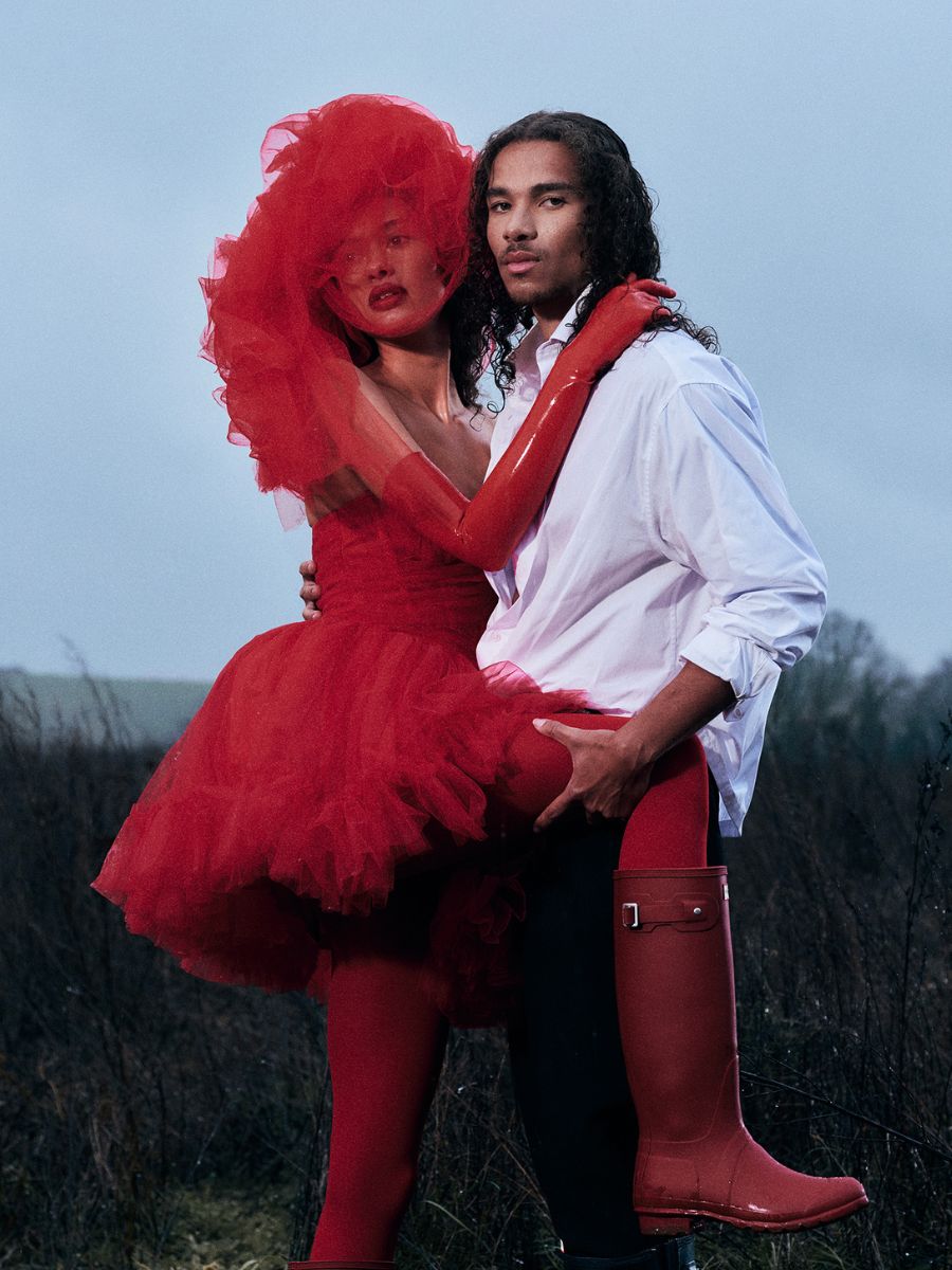Front view of model wearing red tulle hat by Nerida Fraiman for Hunter Boots x Wuthering Heights.