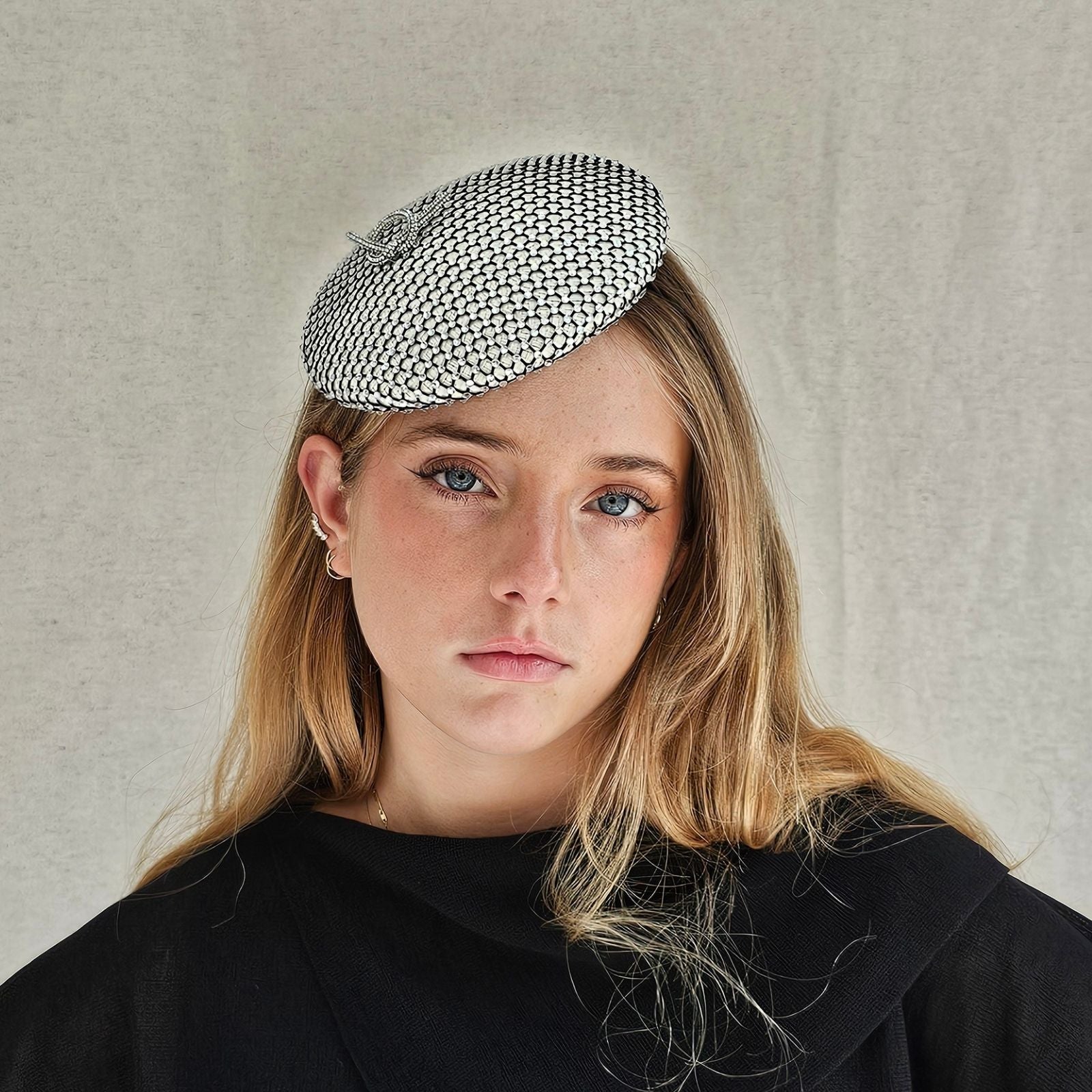 Ivory beret with intricate crystal mesh, front view.