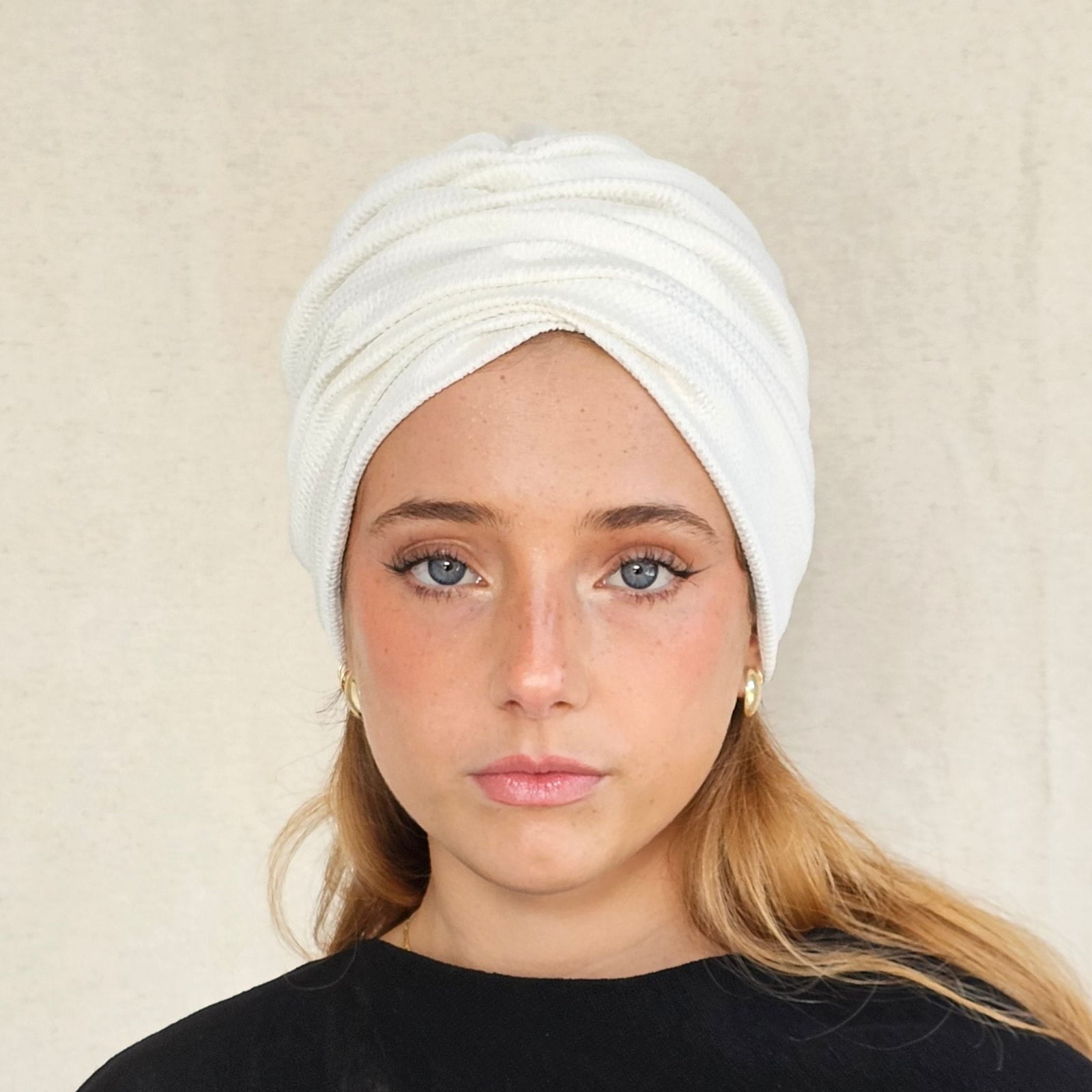 Ivory silk turban with ripple gathers, front view.