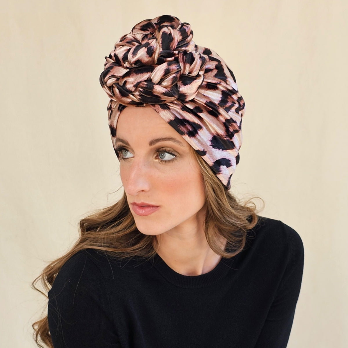 Side view of leopard print velour turban showing braid rose and
gathered folds.