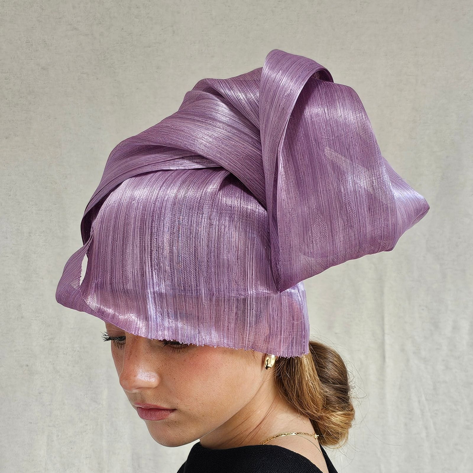 Lilac silk abaca chignon hat, left view.