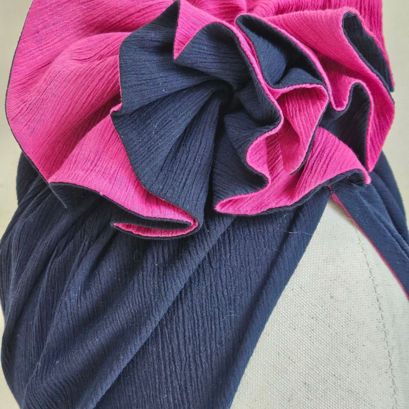 Detail of navy and fuchsia cotton turban with exquisite ruffle.