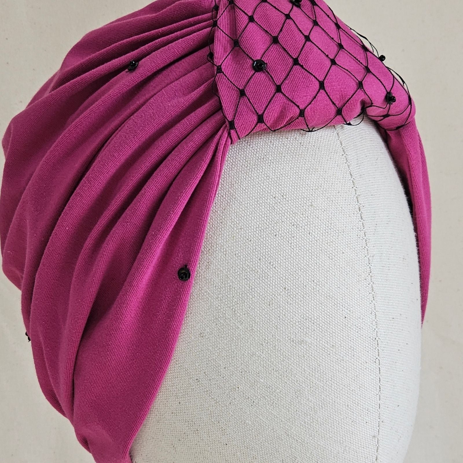 Multicolour crin mohawk headpiece by milliner Nerida Fraiman, shown at an angle.