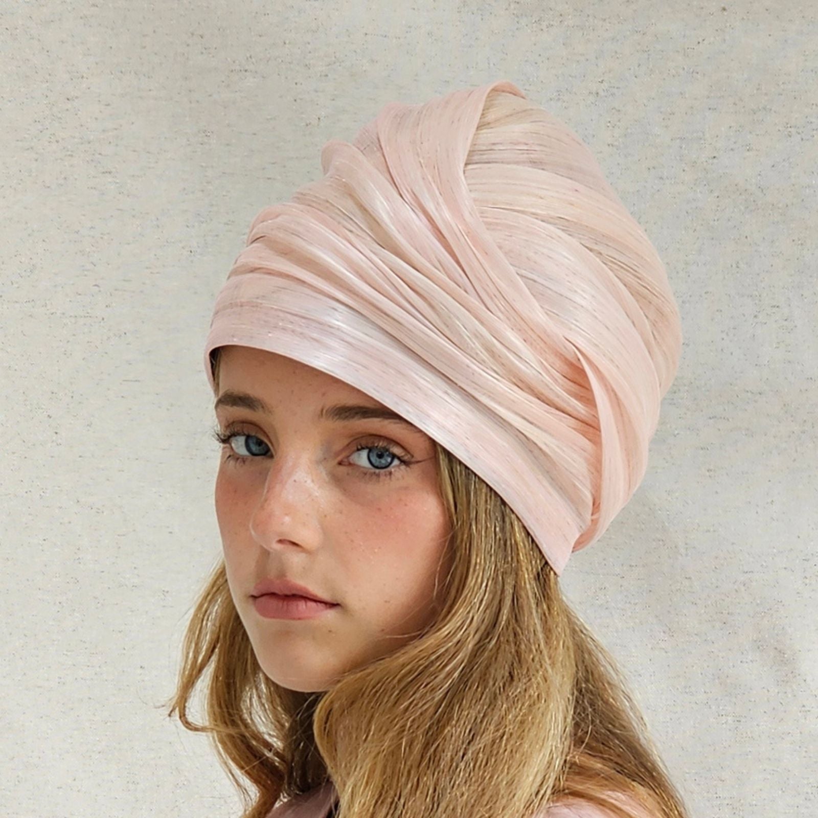 Pink silk abaca turban with beautiful sheen, side view.