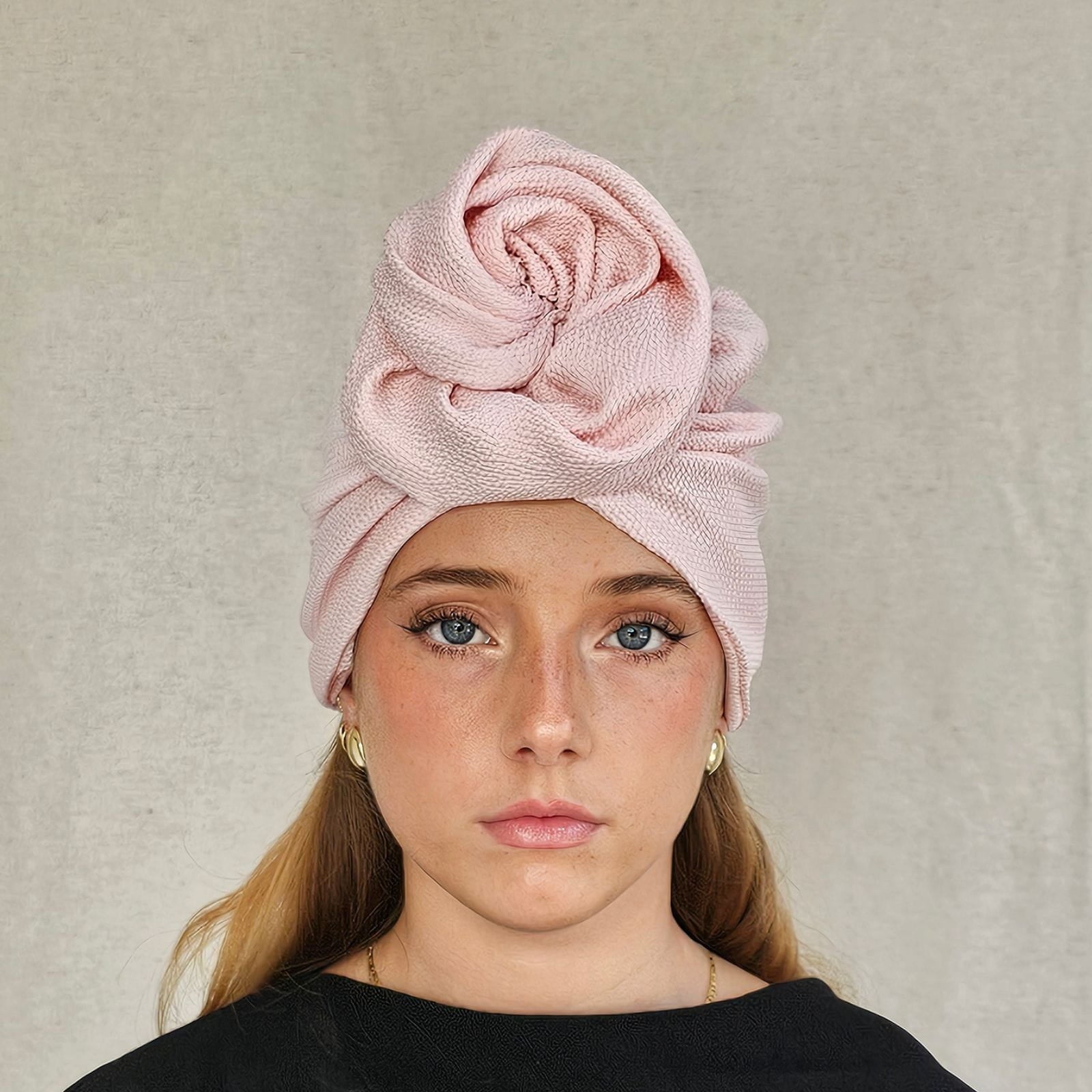 Pink silk turban loosely gathered into beautiful rose swirl, front view.